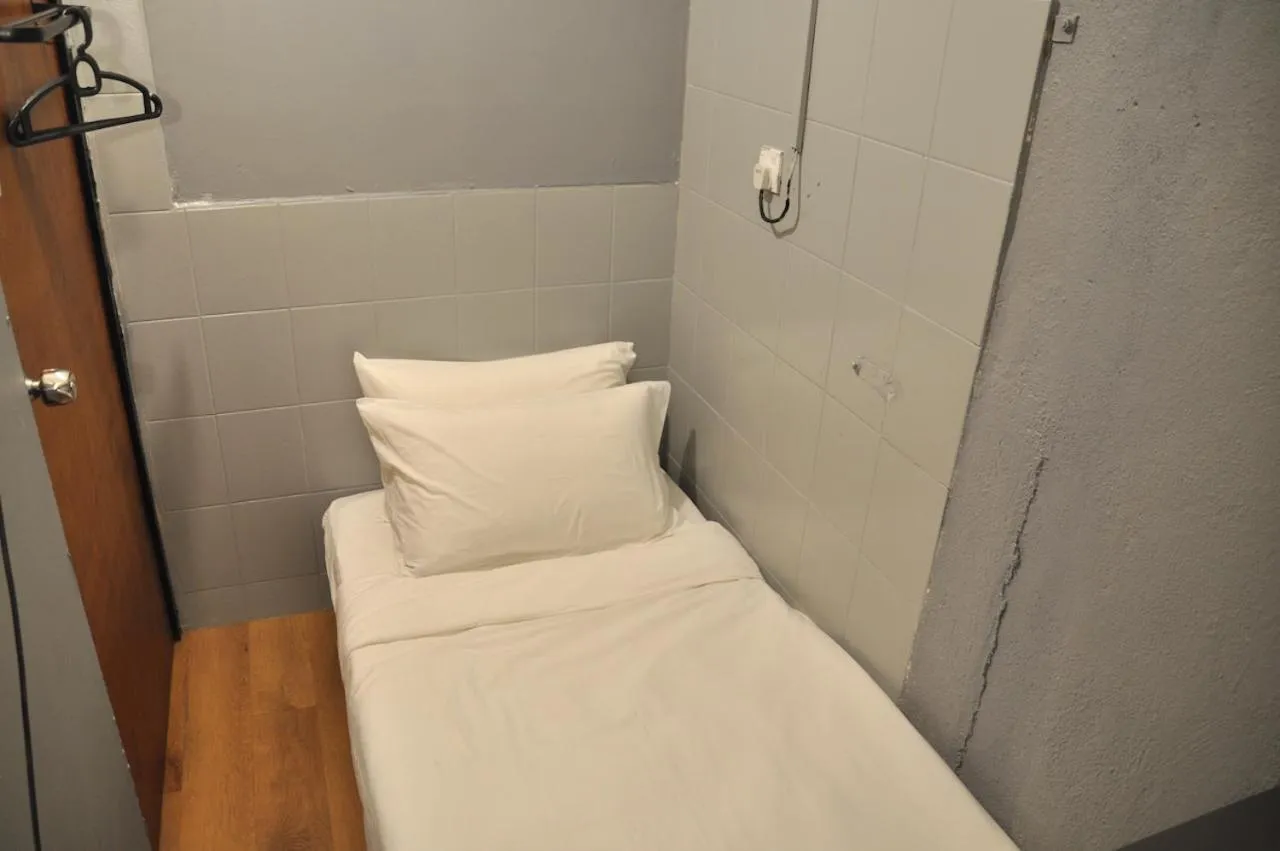 Bed in GRAYHAUS Guest House