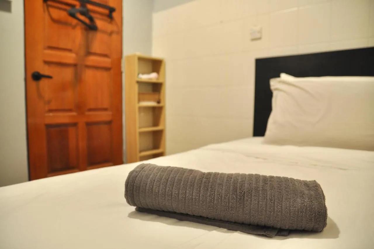 Bed in GRAYHAUS Guest House