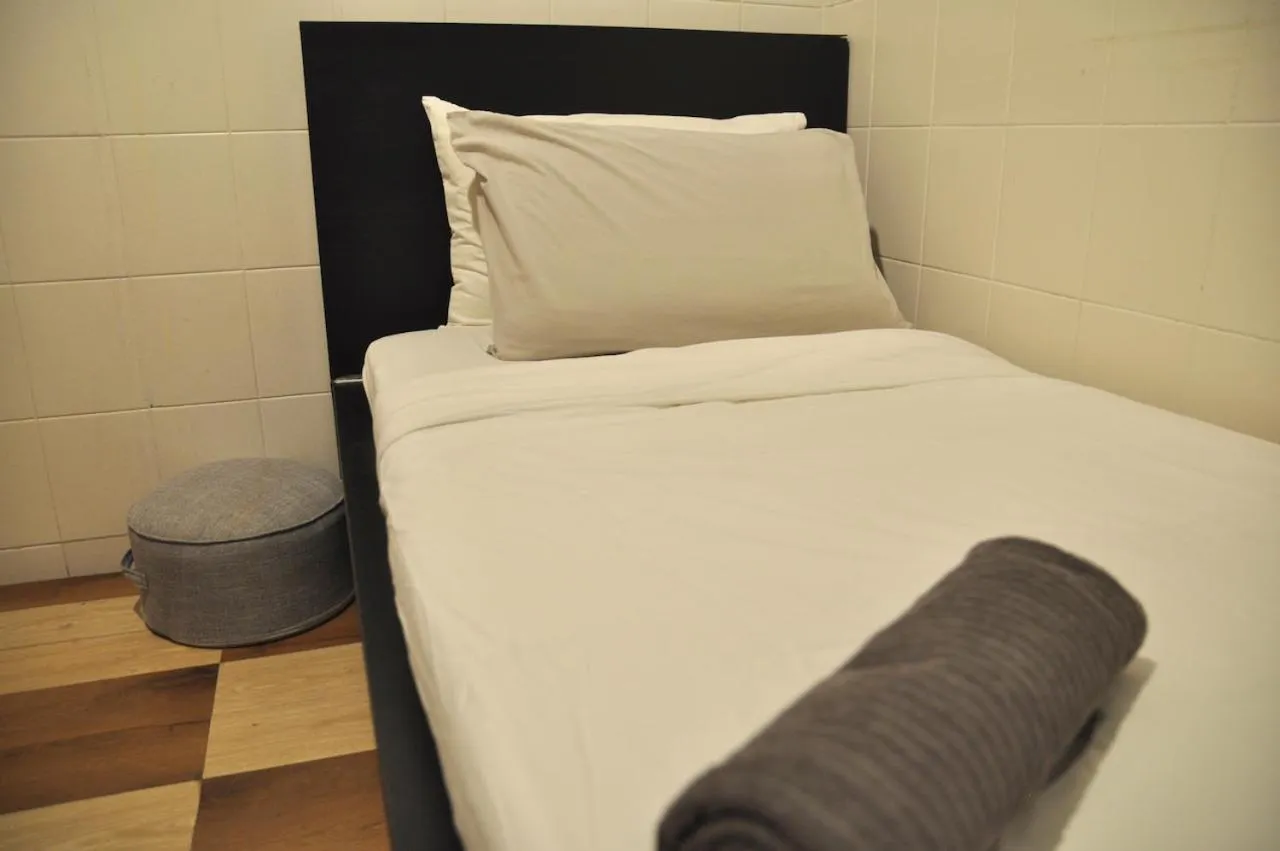 Bed in GRAYHAUS Guest House