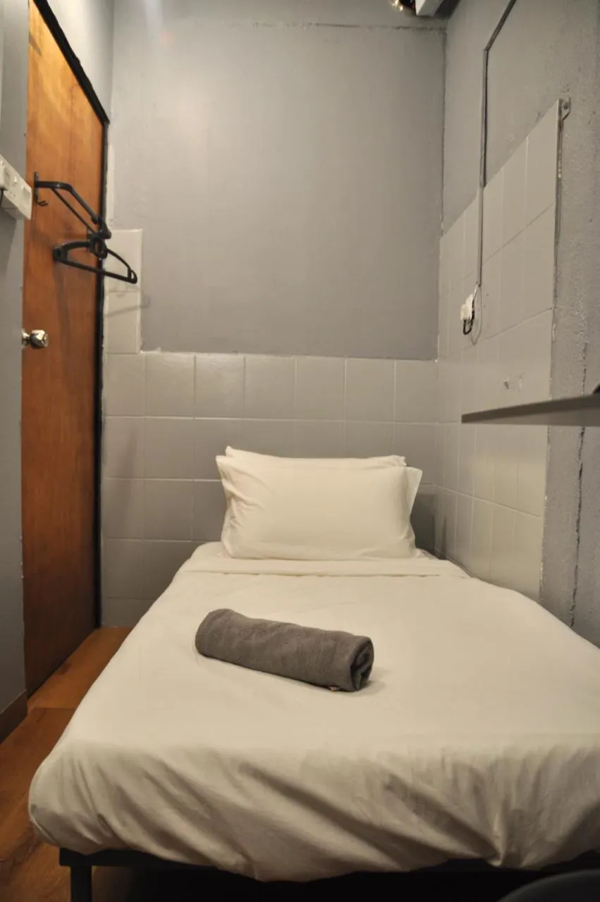 Bed in GRAYHAUS Guest House