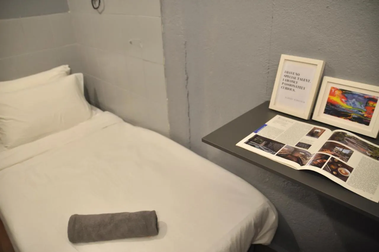 Bed in GRAYHAUS Guest House