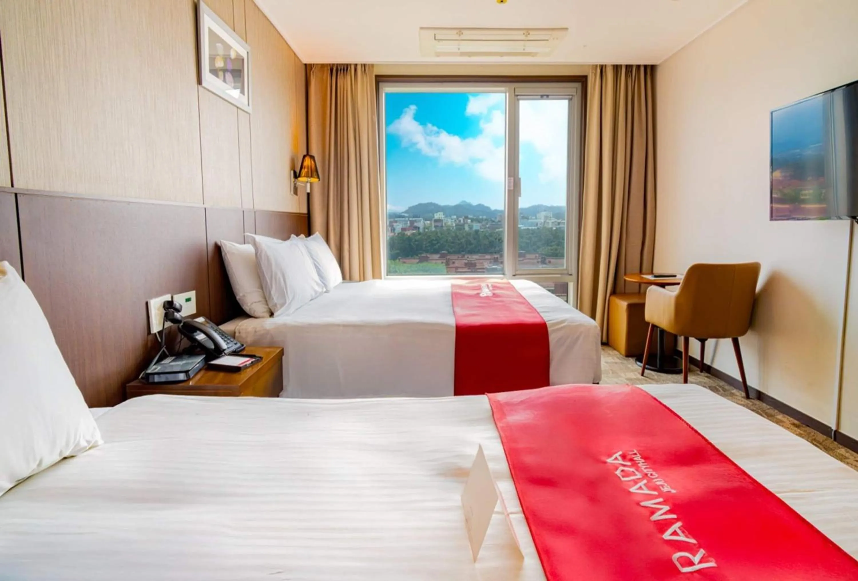 Photo of the whole room, Bed in Ramada by Wyndham Jeju City Hall