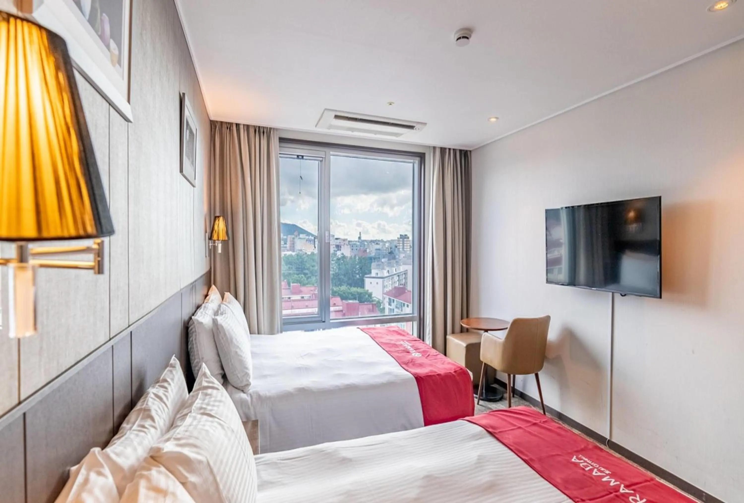 Photo of the whole room, Bed in Ramada by Wyndham Jeju City Hall