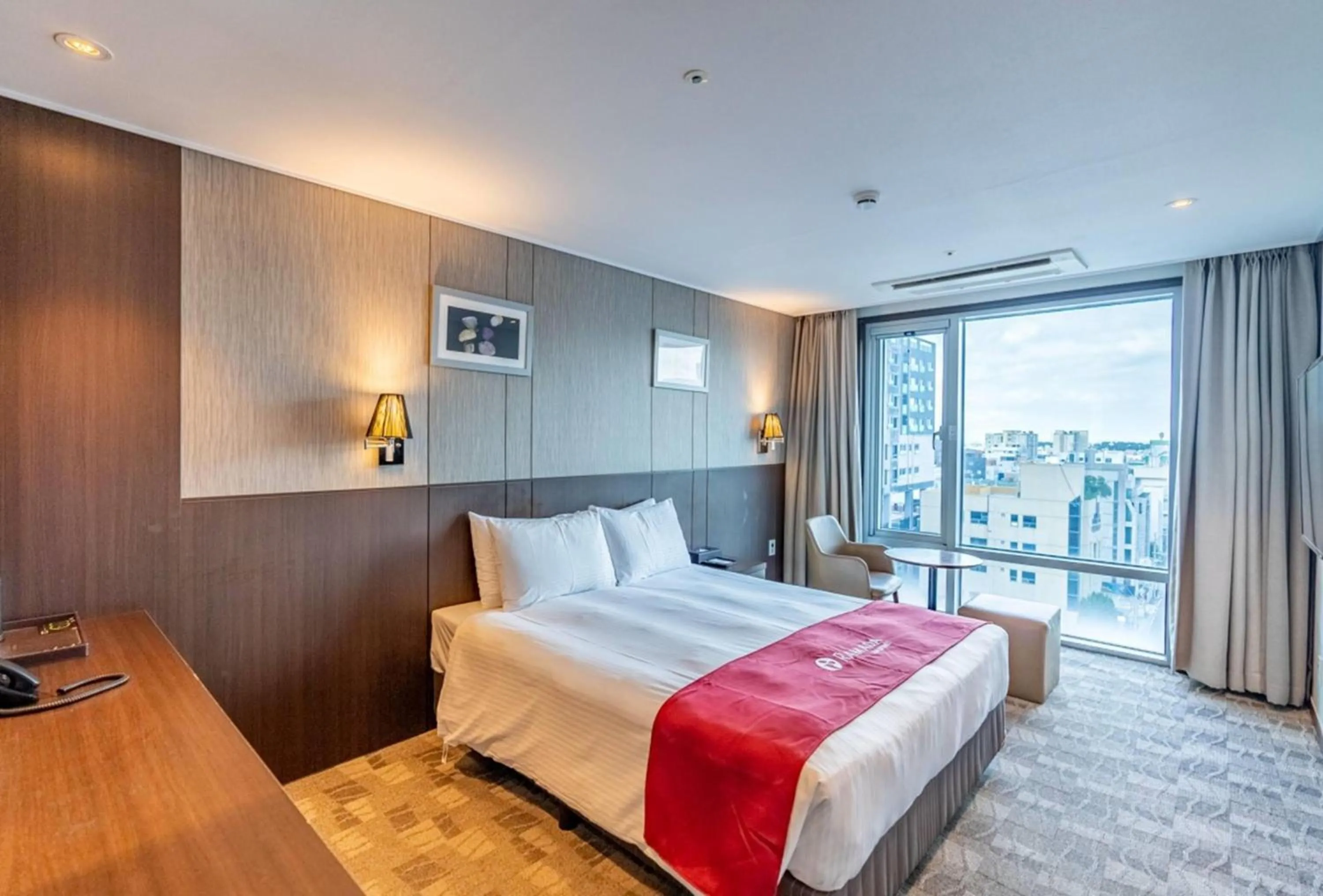 Photo of the whole room, Bed in Ramada by Wyndham Jeju City Hall