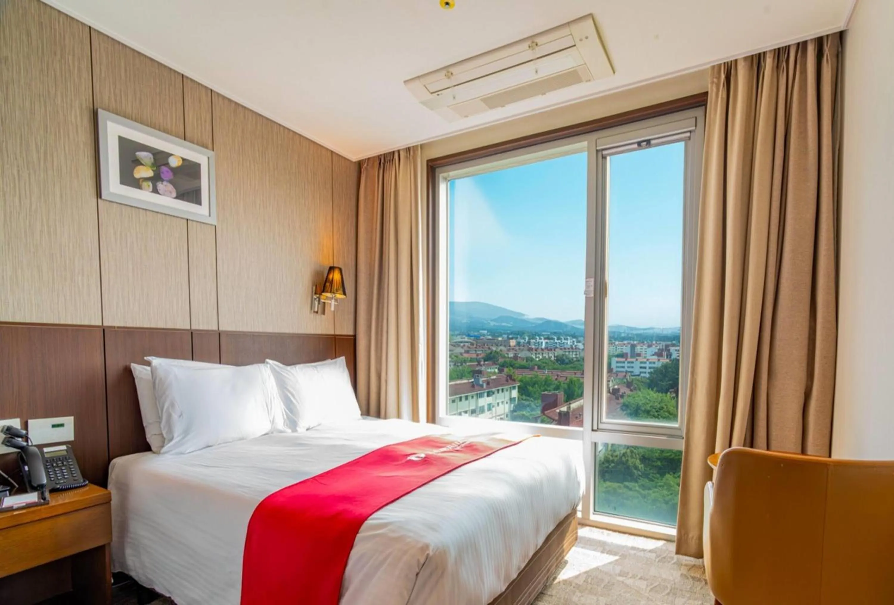 Photo of the whole room, Bed in Ramada by Wyndham Jeju City Hall