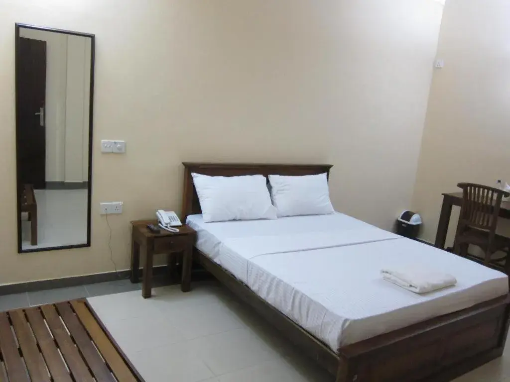 Deluxe Double Room (2 Adults + 1 Child) - single occupancy in Hotel Oviya Deluxe Double Room (2 Adults + 1 Child) - single occupancy in Hotel Oviya