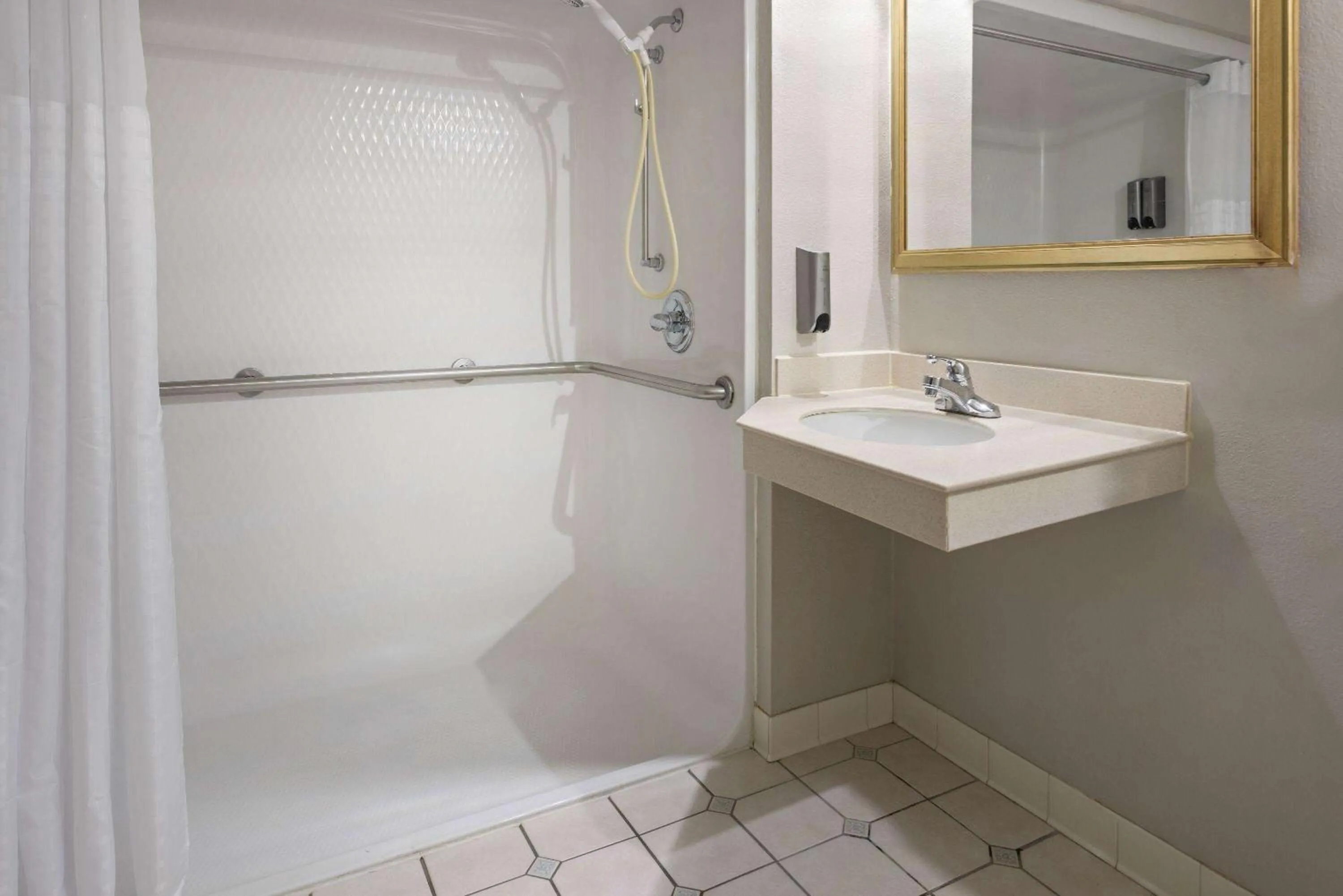 Bathroom in Days Inn & Suites by Wyndham Albany