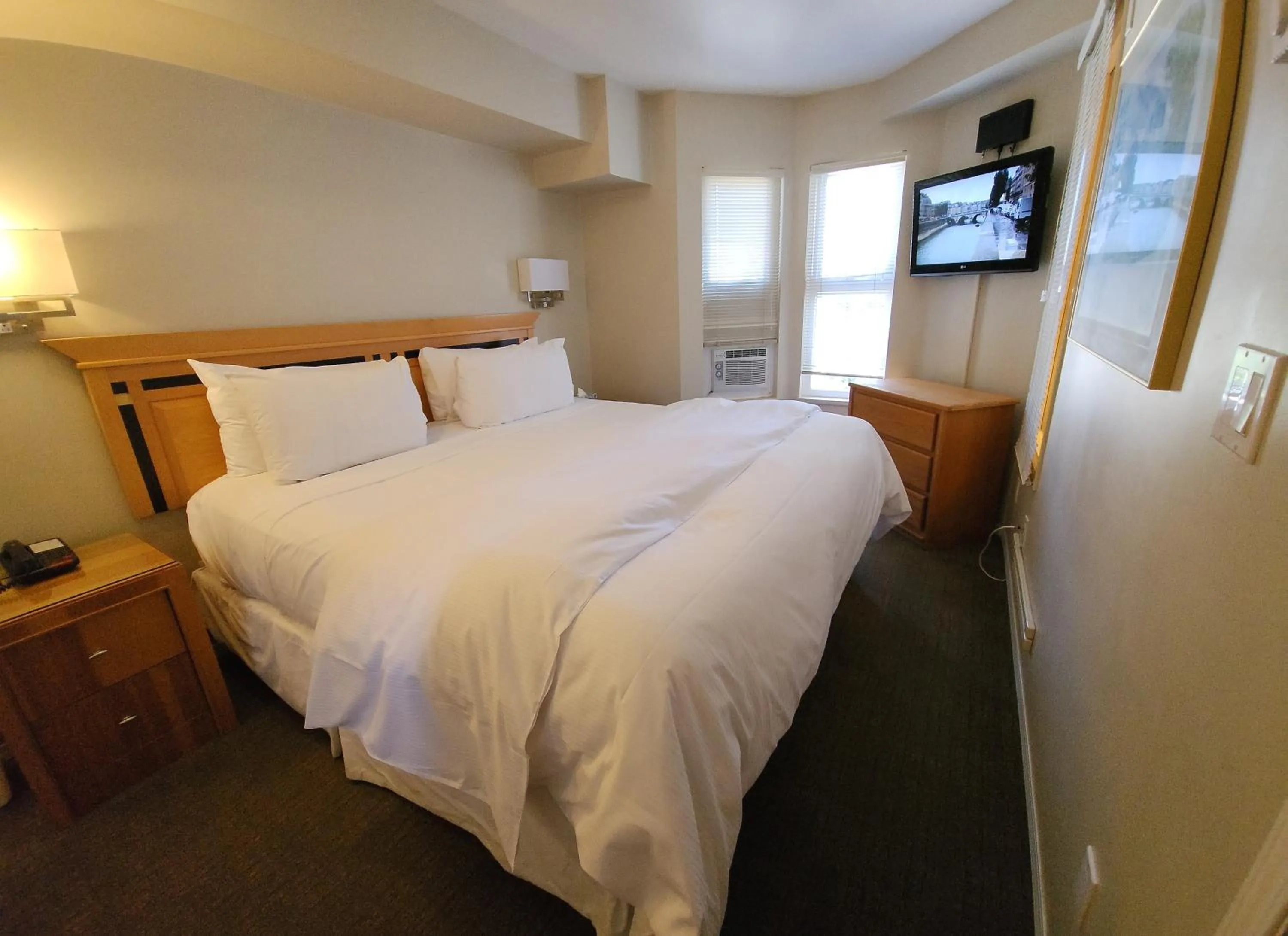 Bed in Times Square Suites Hotel