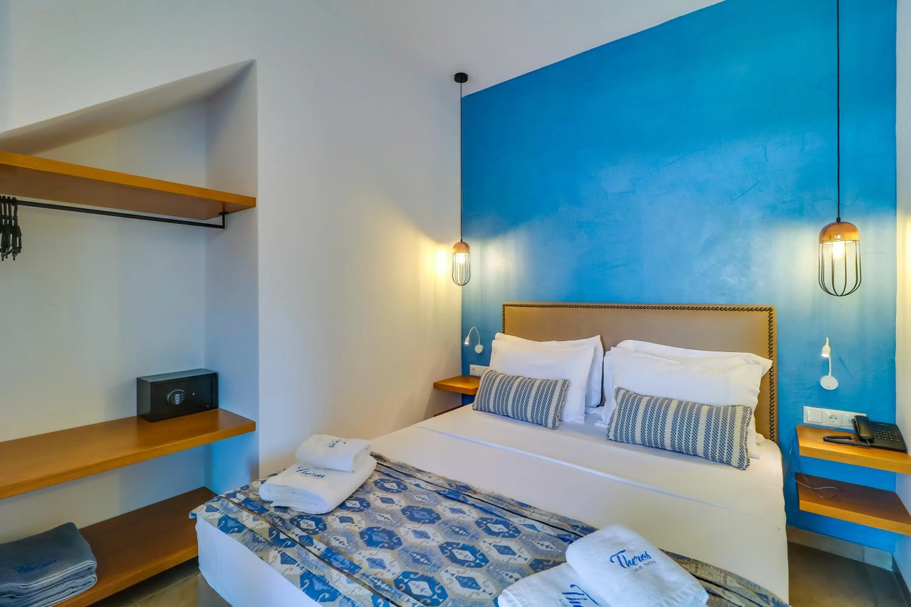Bed in Theros Villas & Suites