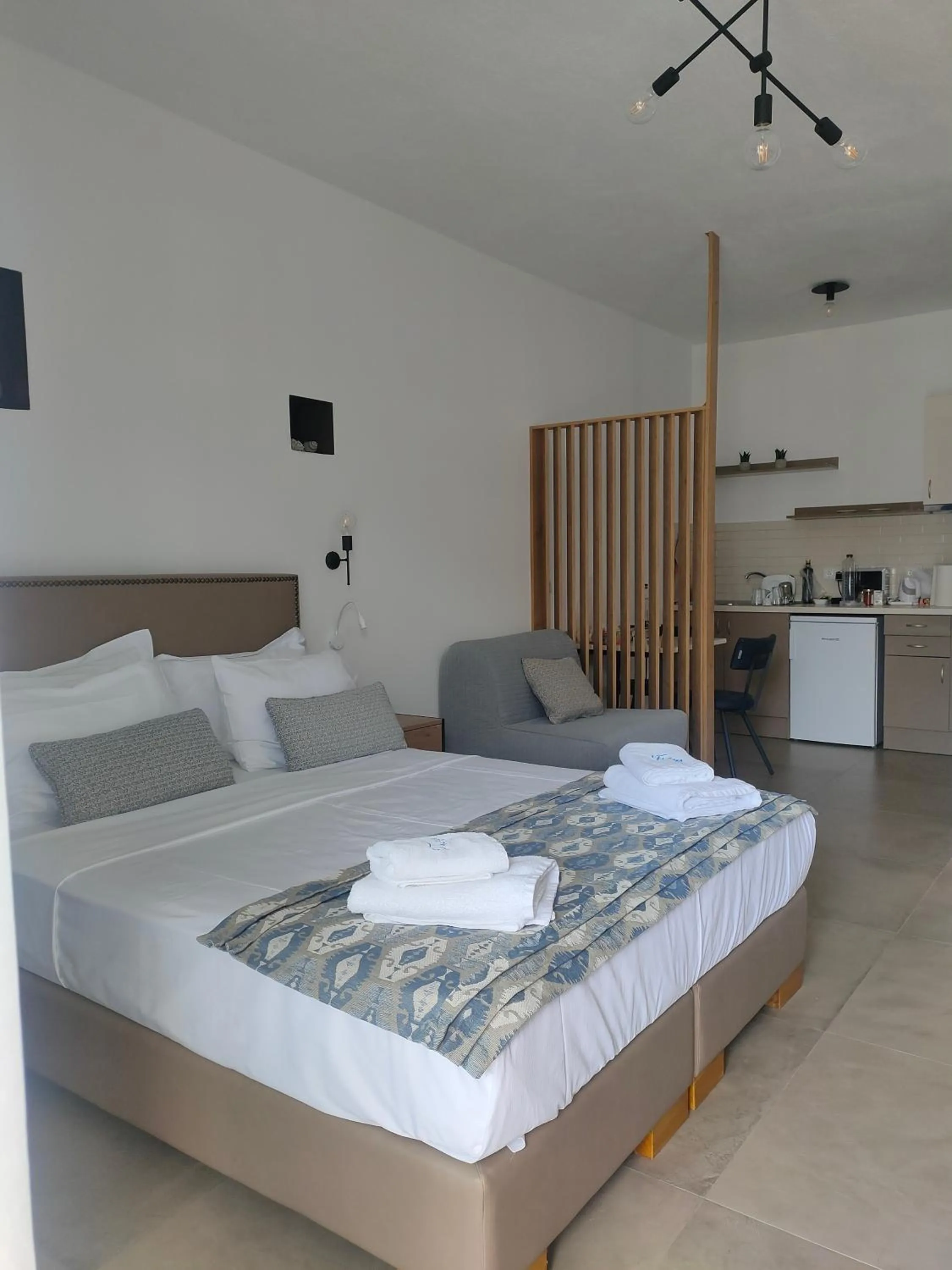 Bed in Theros Villas & Suites