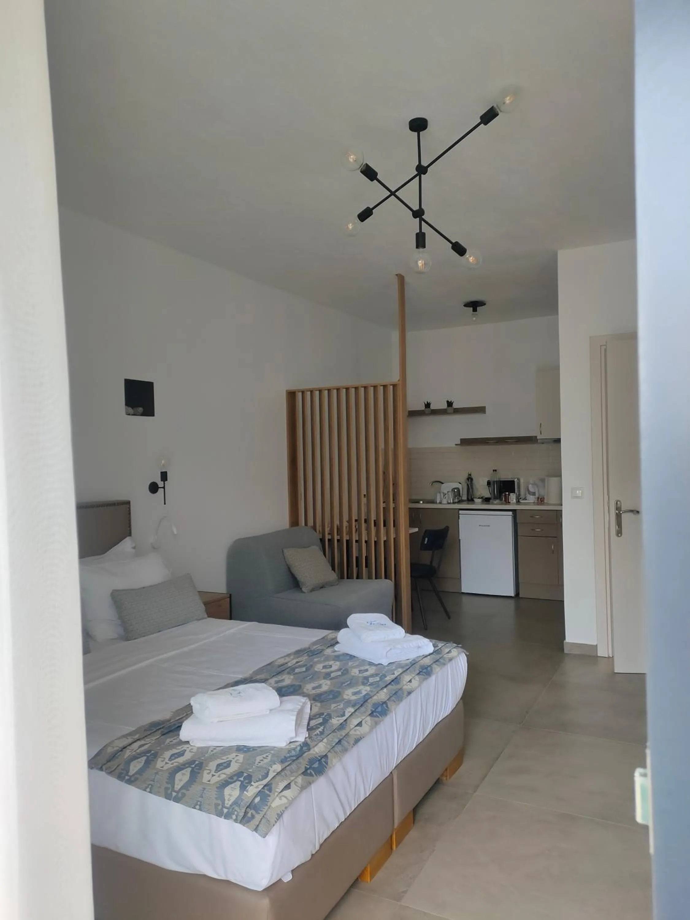 Bed in Theros Villas & Suites