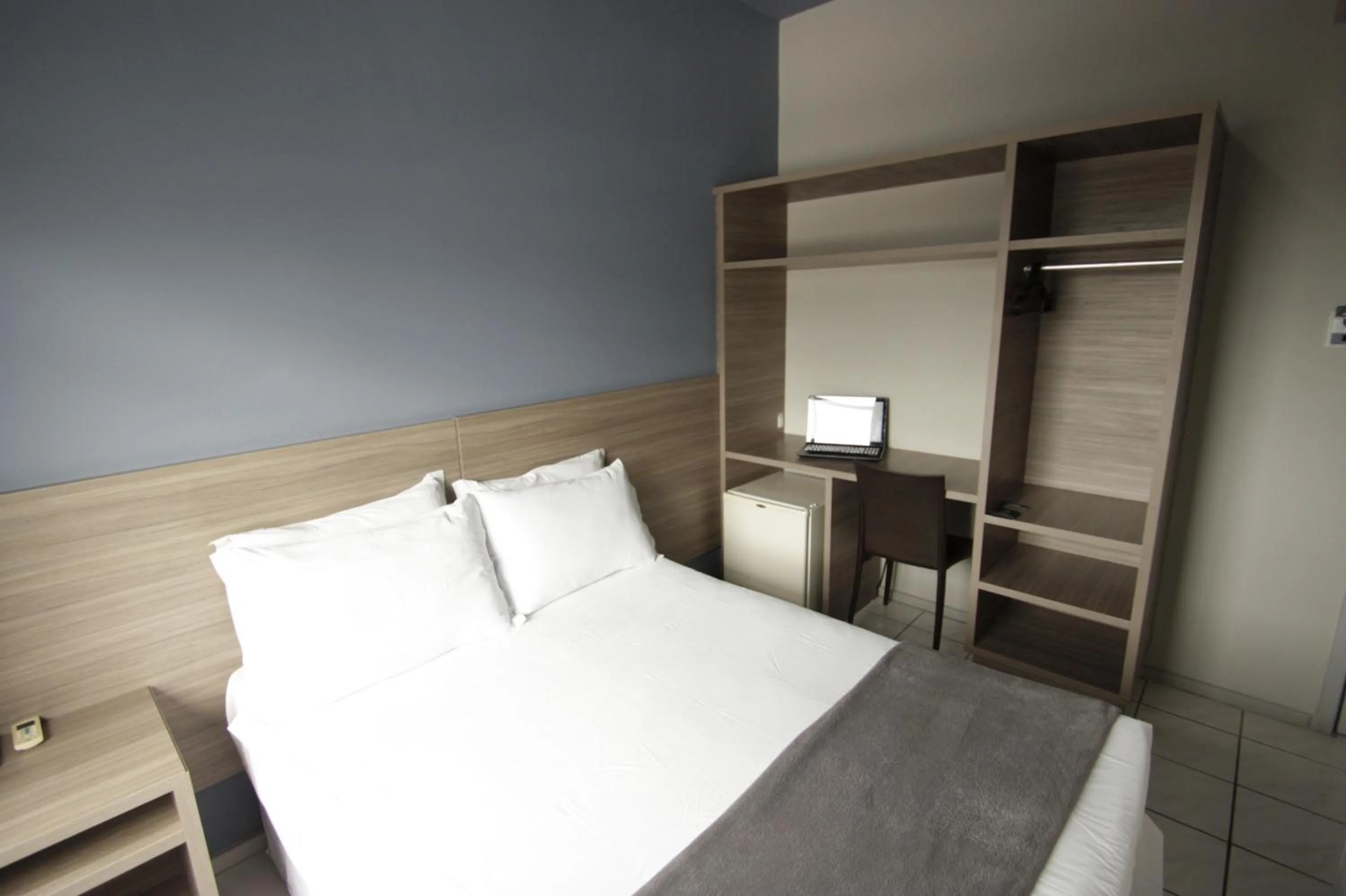 Bed in Kennedy Slim Hotel