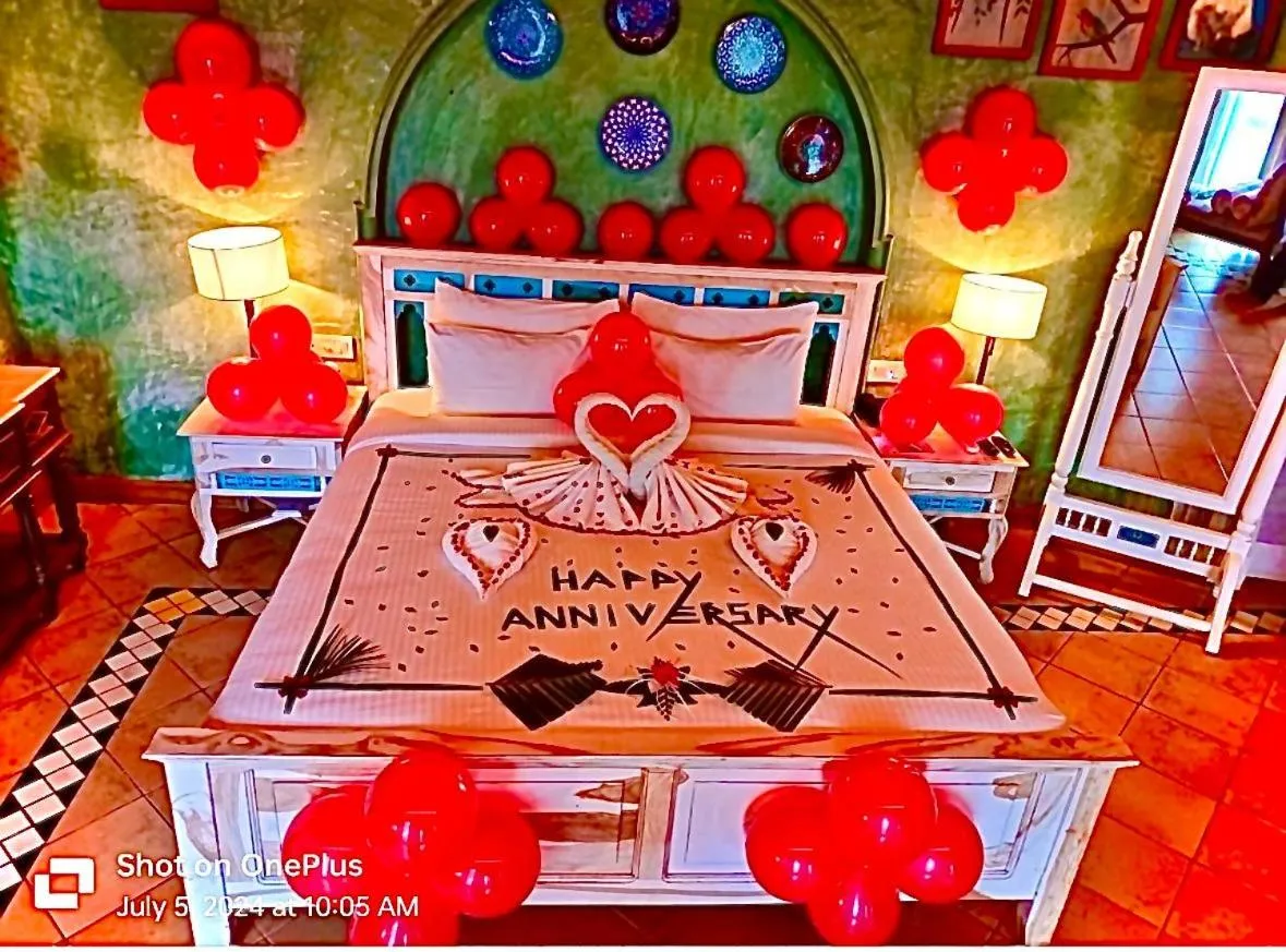 Bed in Amritara Aura Resort & Spa