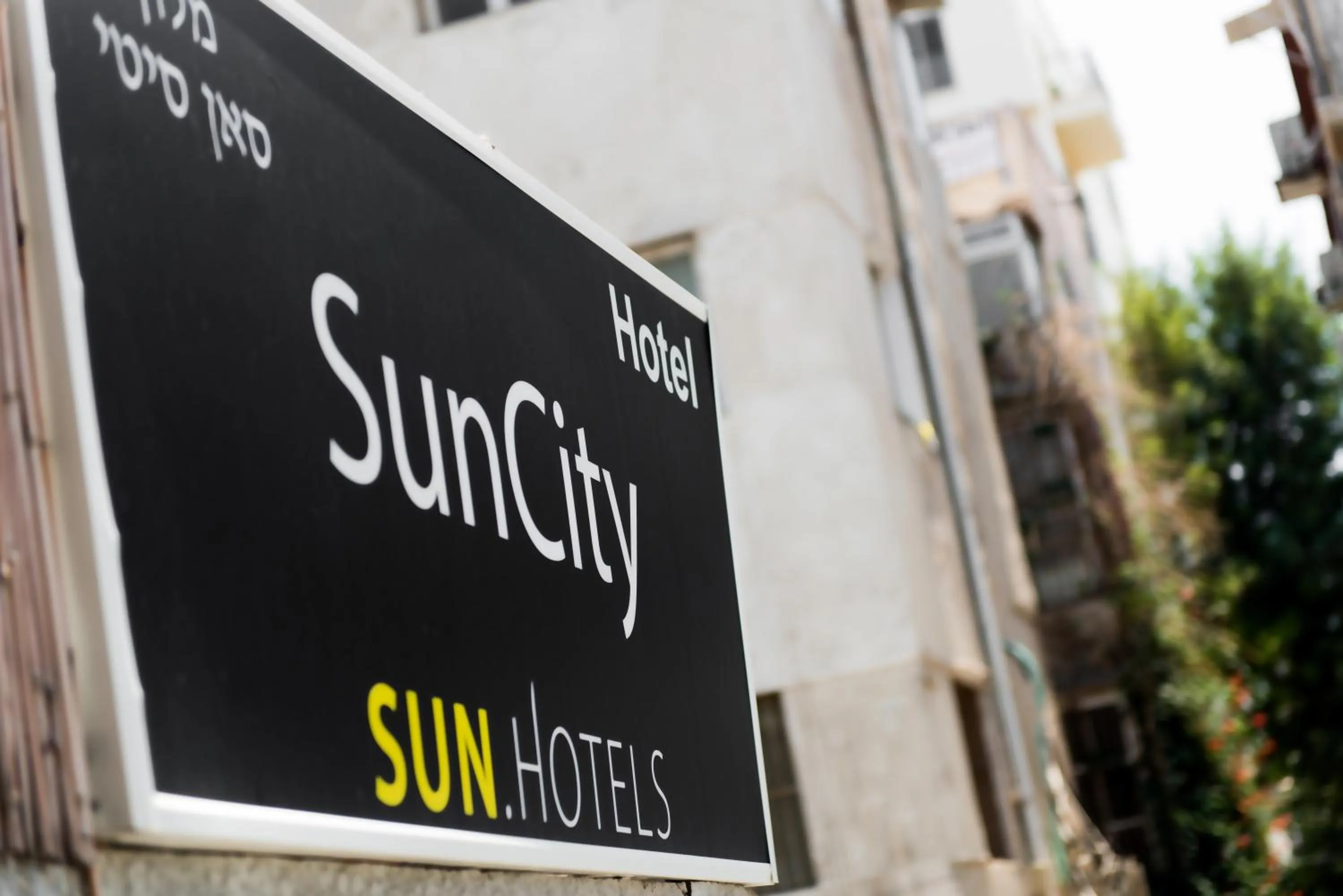 Property logo or sign in Sun City Hotel