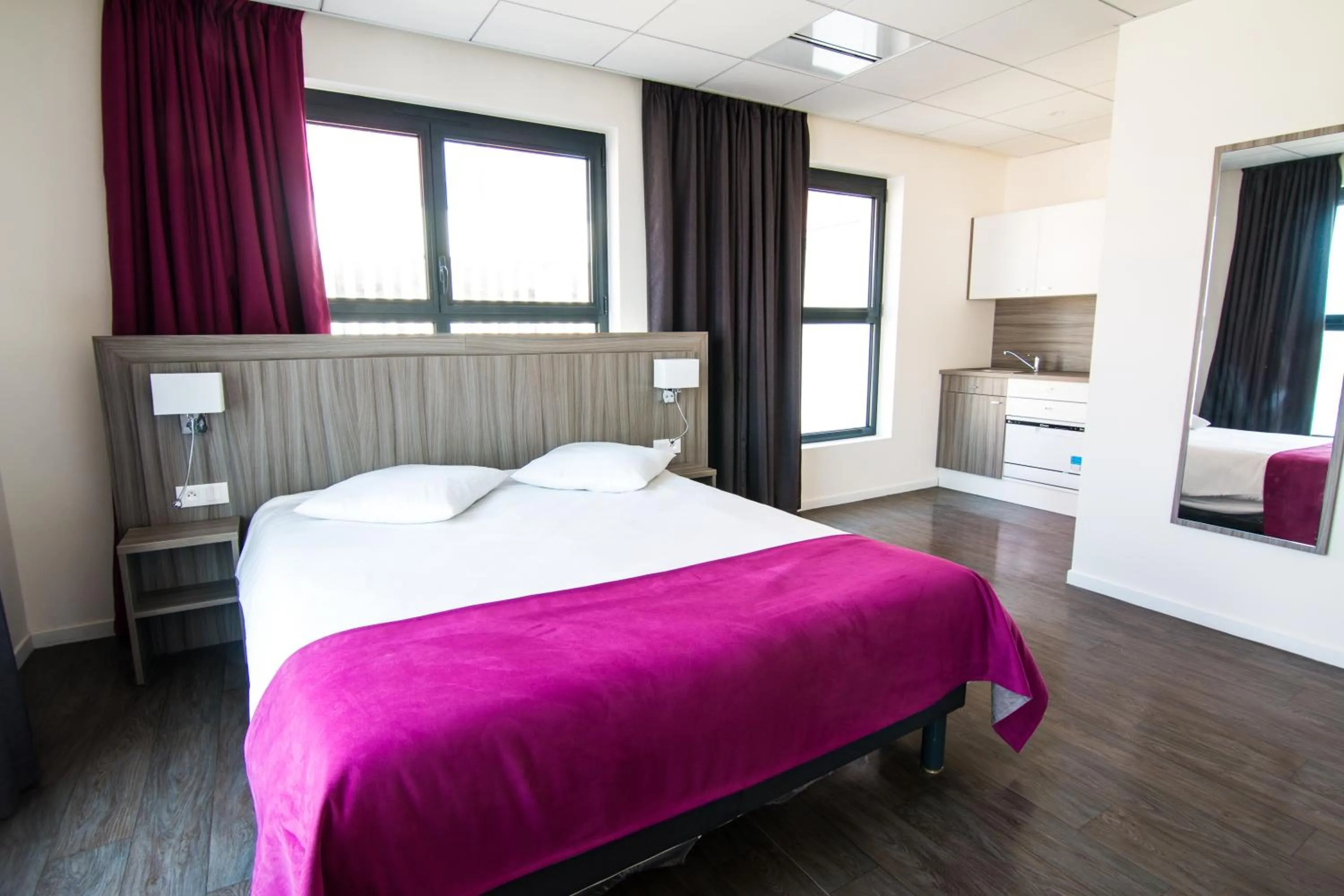 Bed in Tulip Inn Thionville Residences
