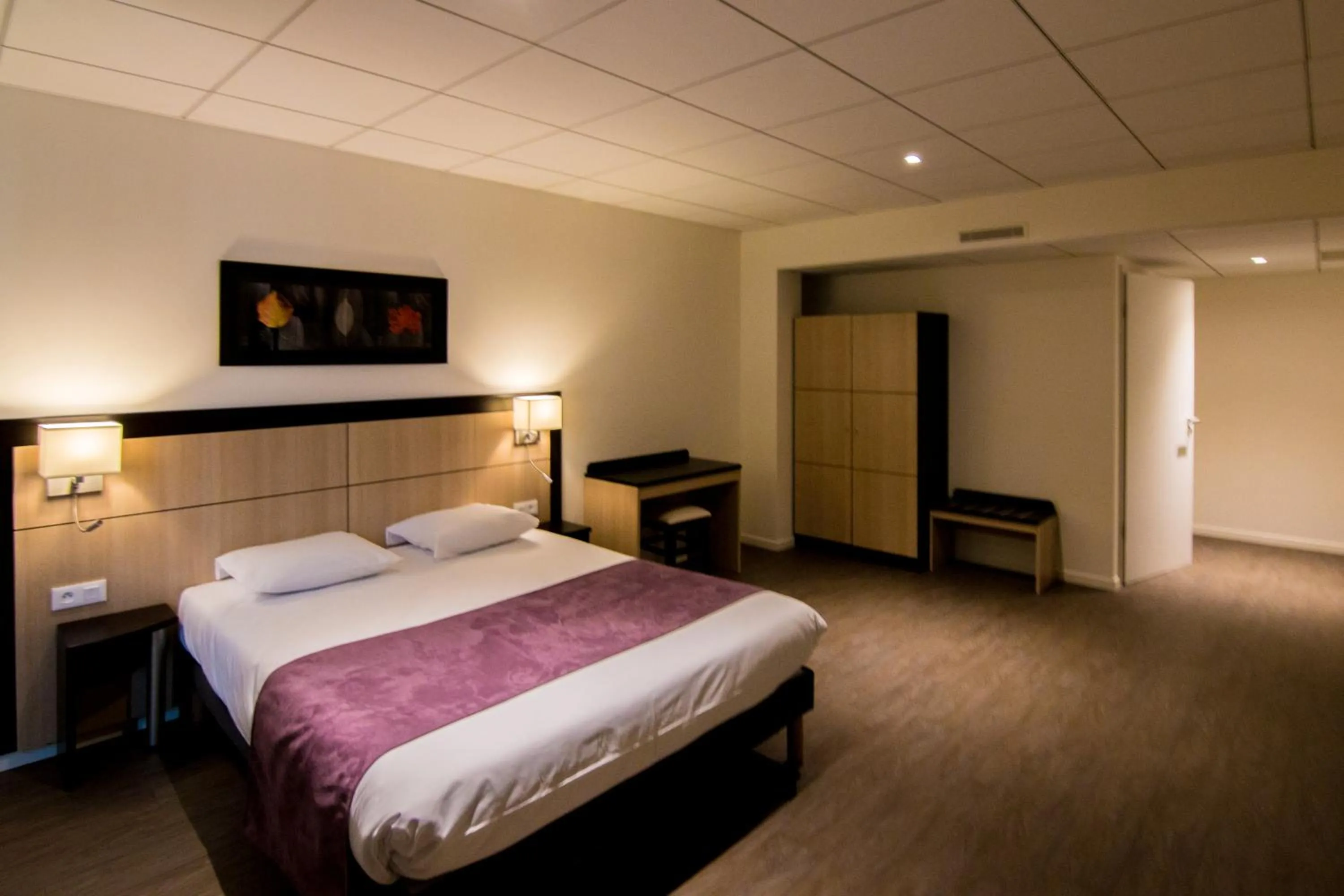 Bed in Tulip Inn Thionville Residences