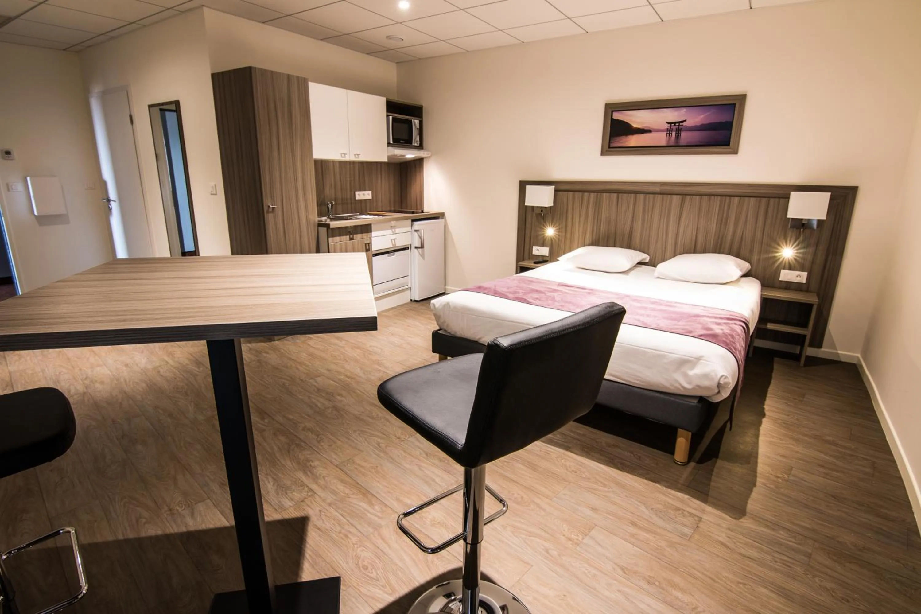 Bed in Tulip Inn Thionville Residences