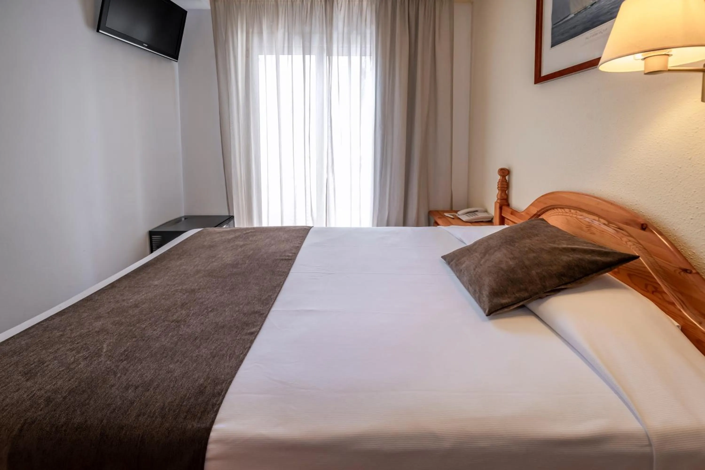 Photo of the whole room, Bed in Hotel GHT Neptuno-Tossa & Venus SPA