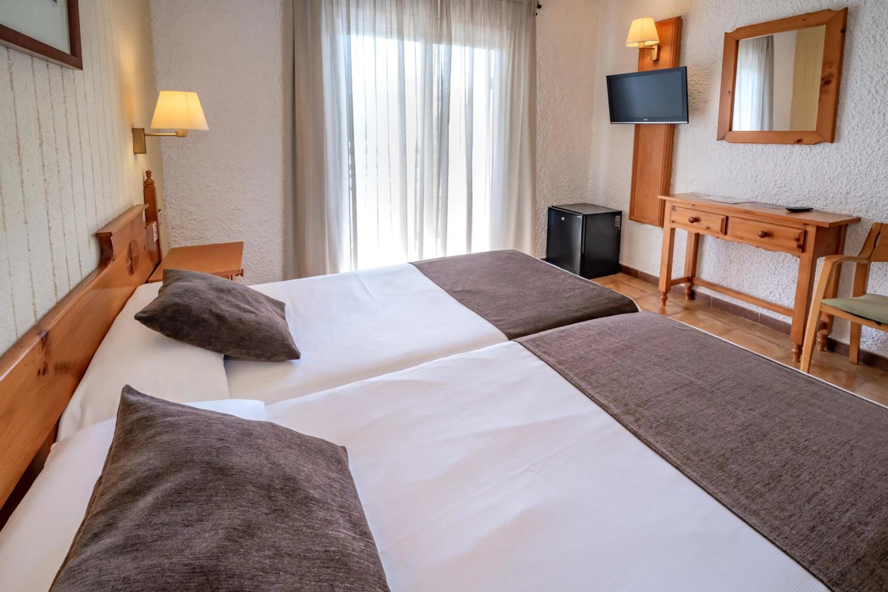 Photo of the whole room, Bed in Hotel GHT Neptuno-Tossa & Venus SPA