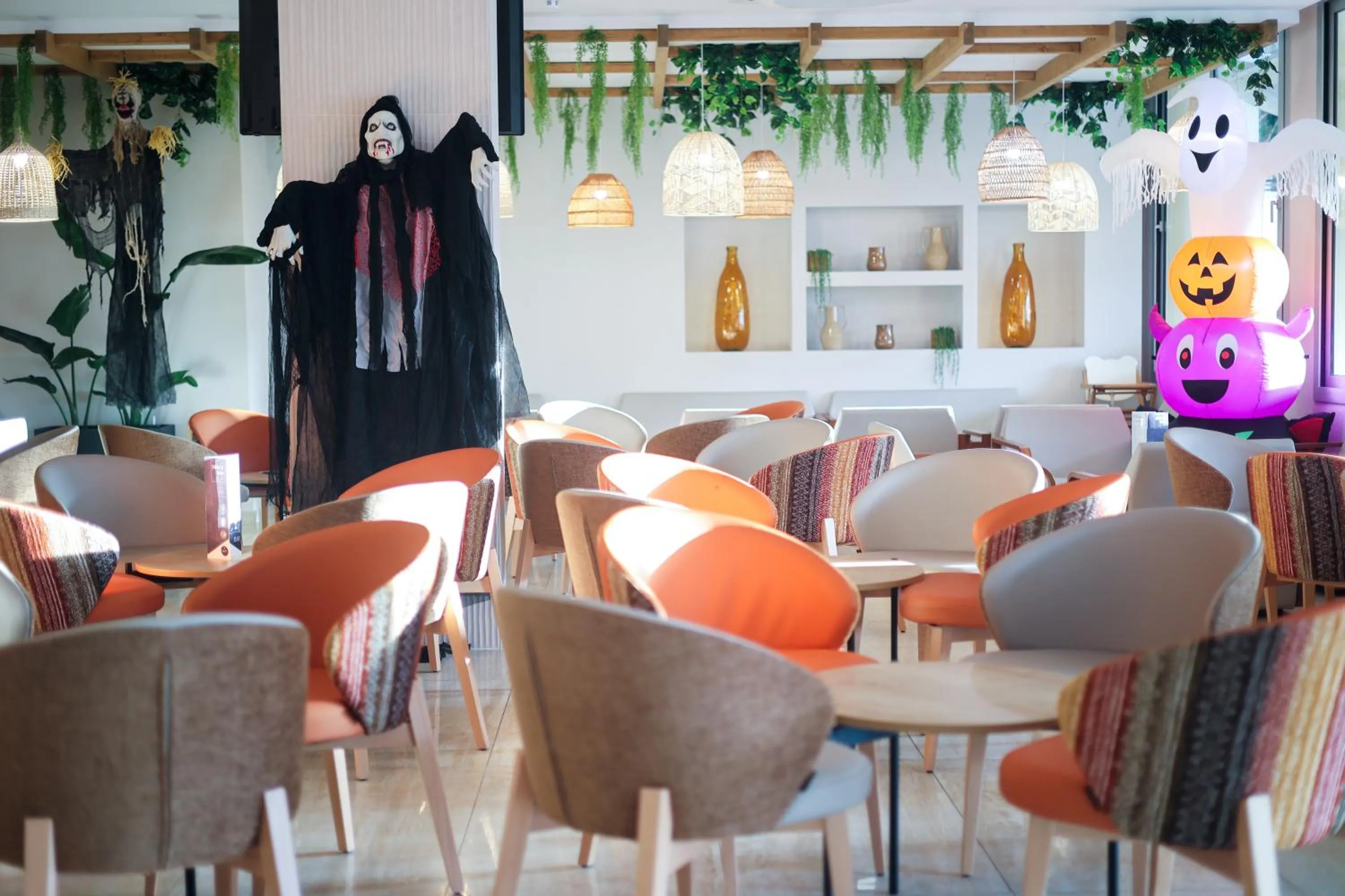 Communal lounge/ TV room in GHT Oasis Tossa & Spa