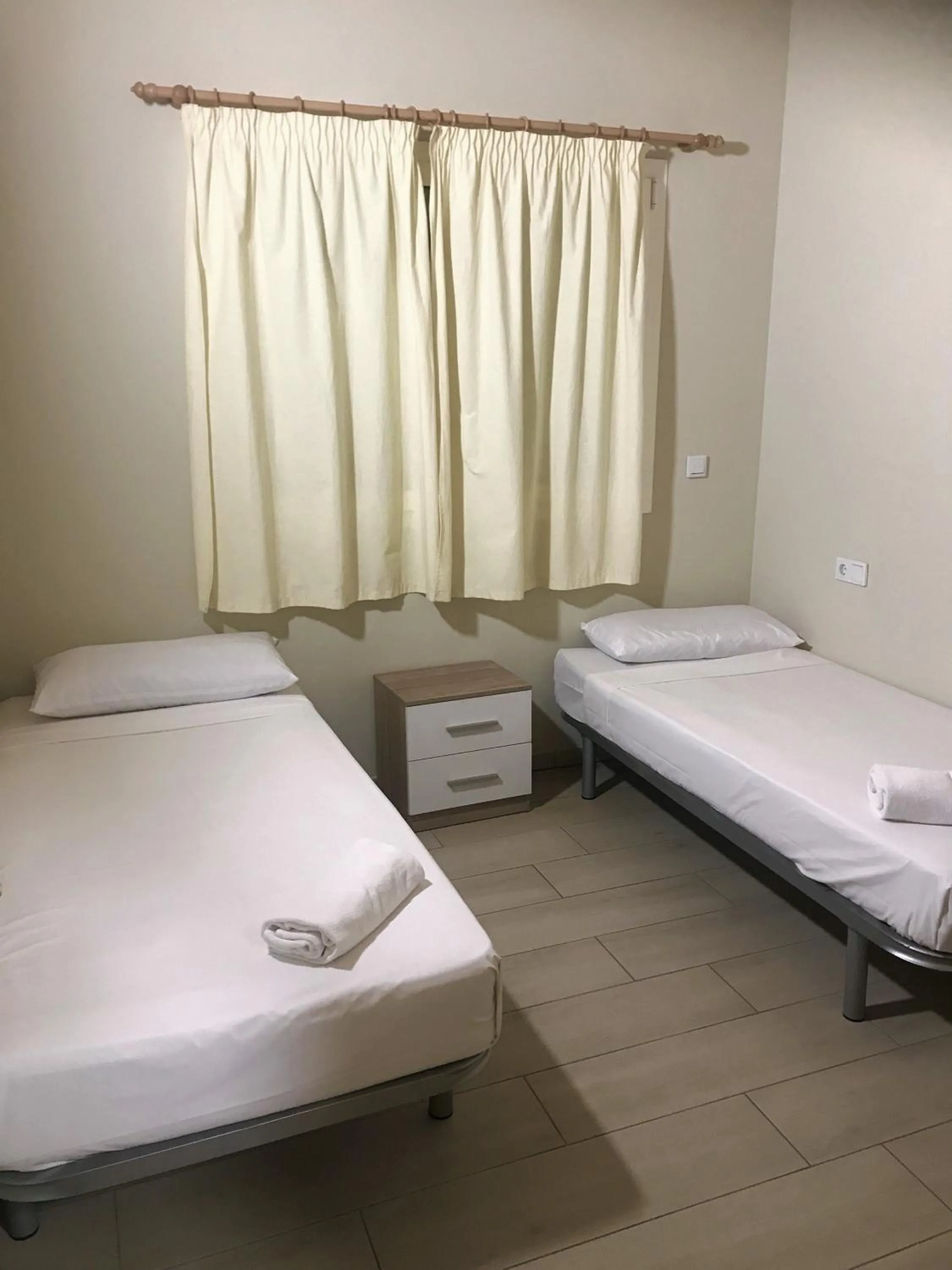 Bed in Apartamentos Giuliano