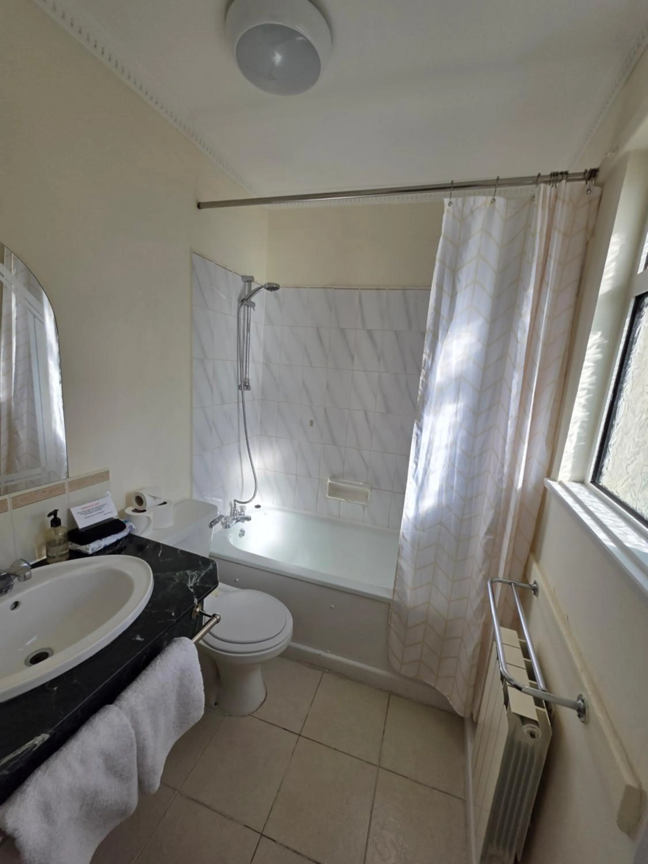 Bathroom in Marina Metro Hotel