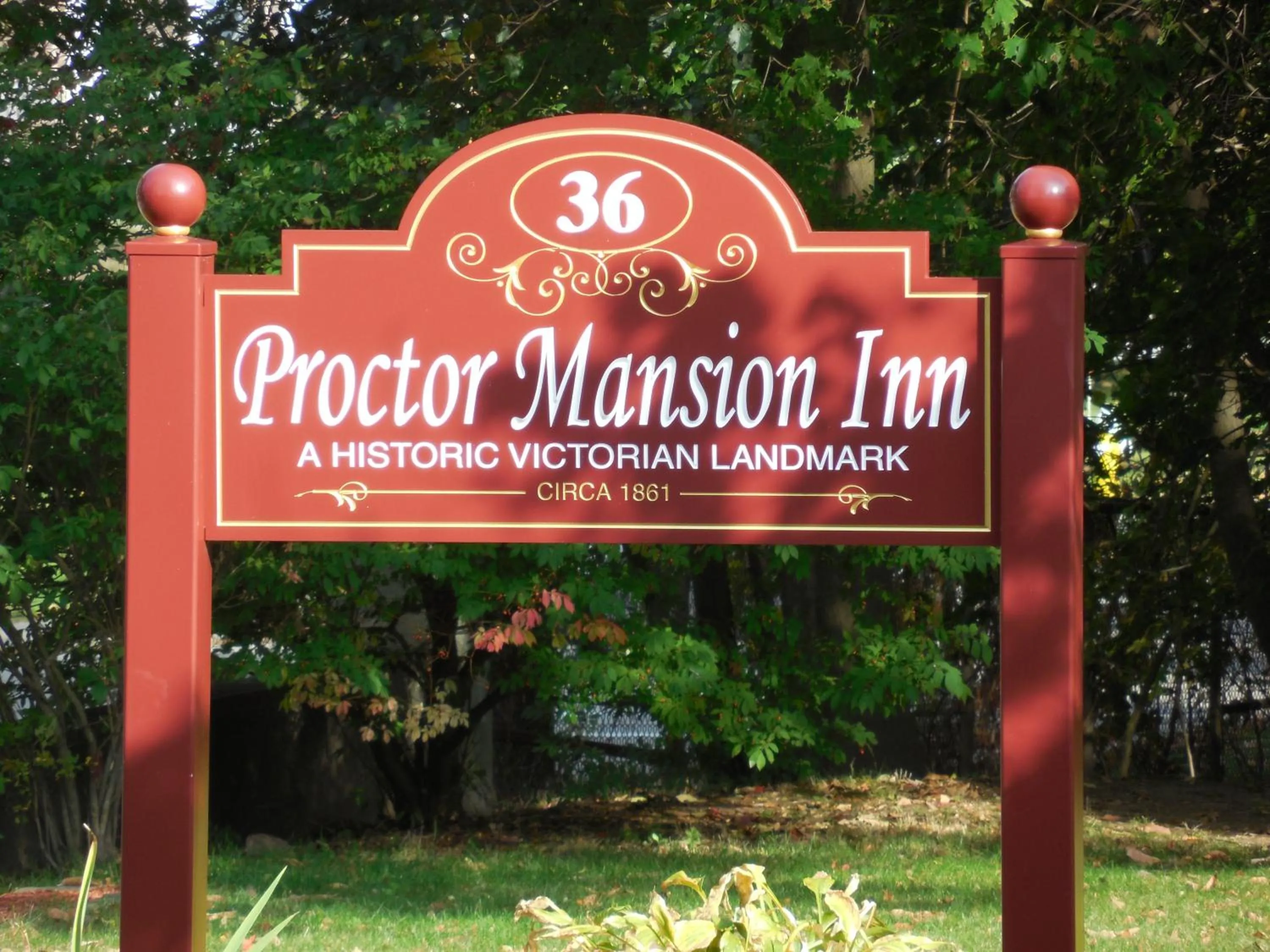 Property logo or sign in Proctor Mansion Inn