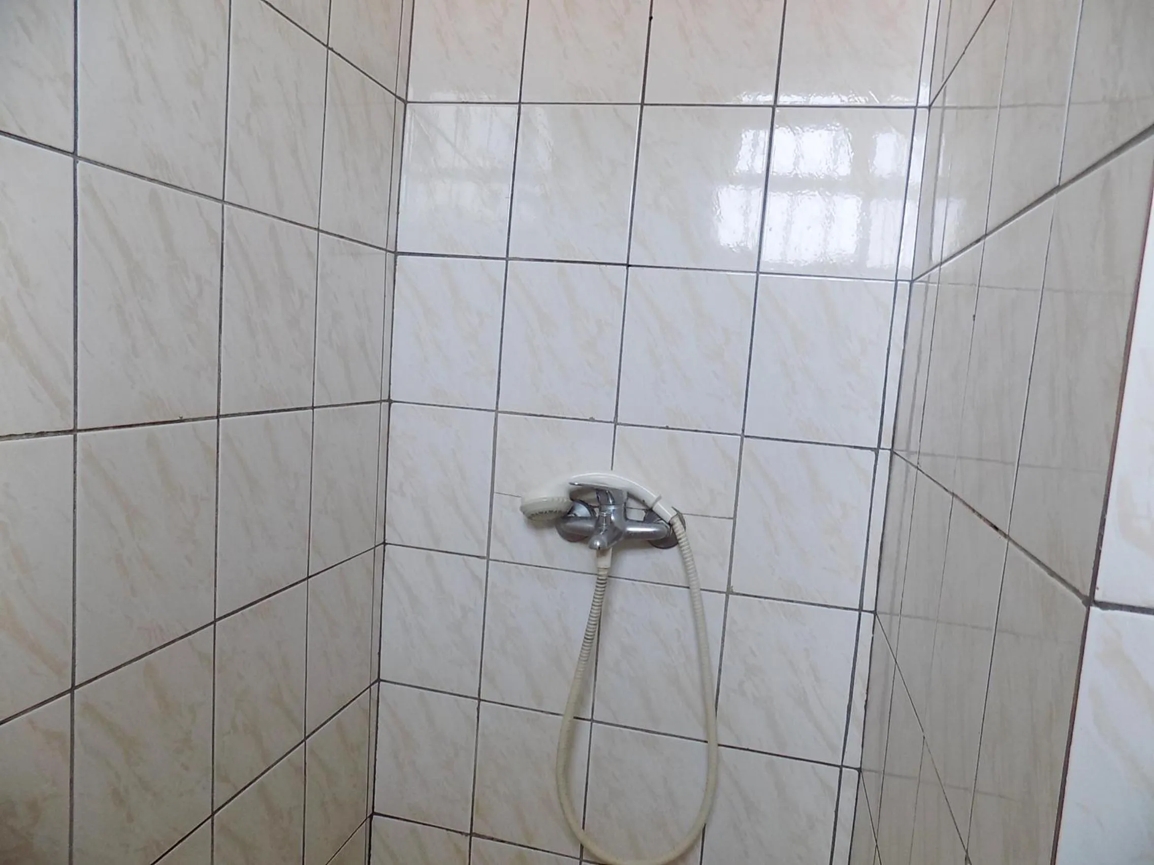 Shower in Sunrise Apartments Hotel Fort Portal