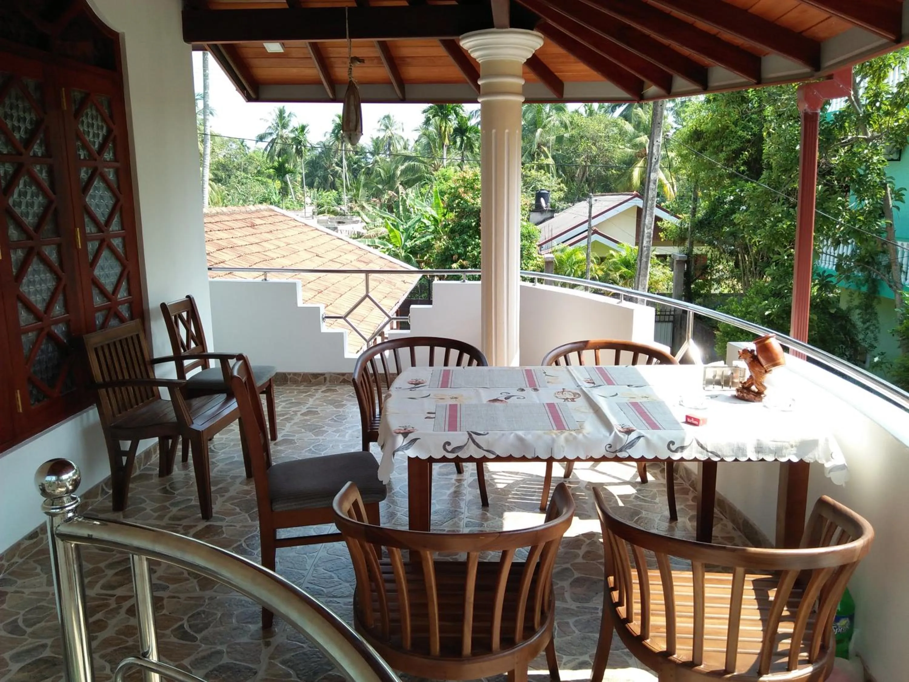 Communal lounge/ TV room in White Elephant Villa & Restaurant