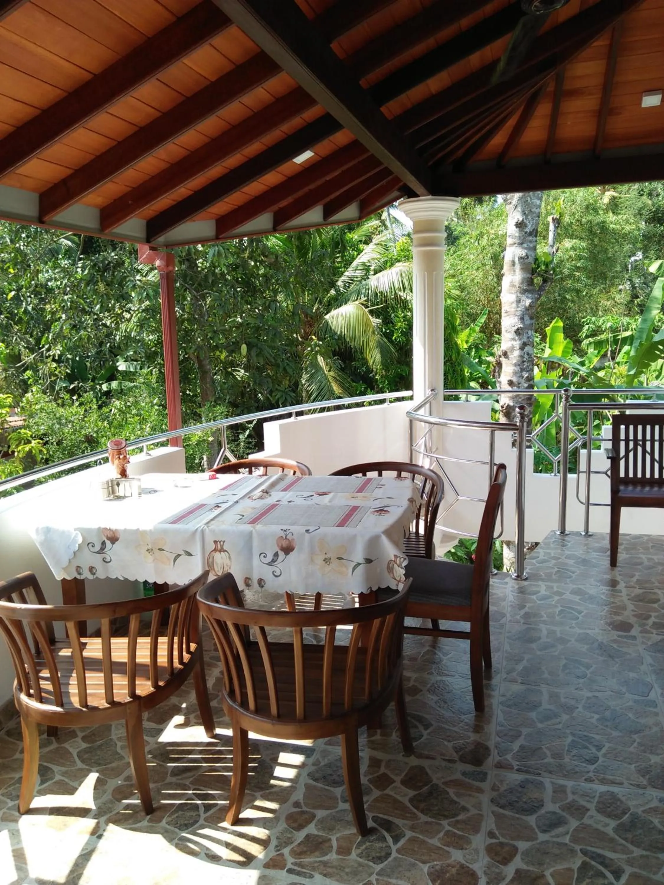 Communal lounge/ TV room in White Elephant Villa & Restaurant