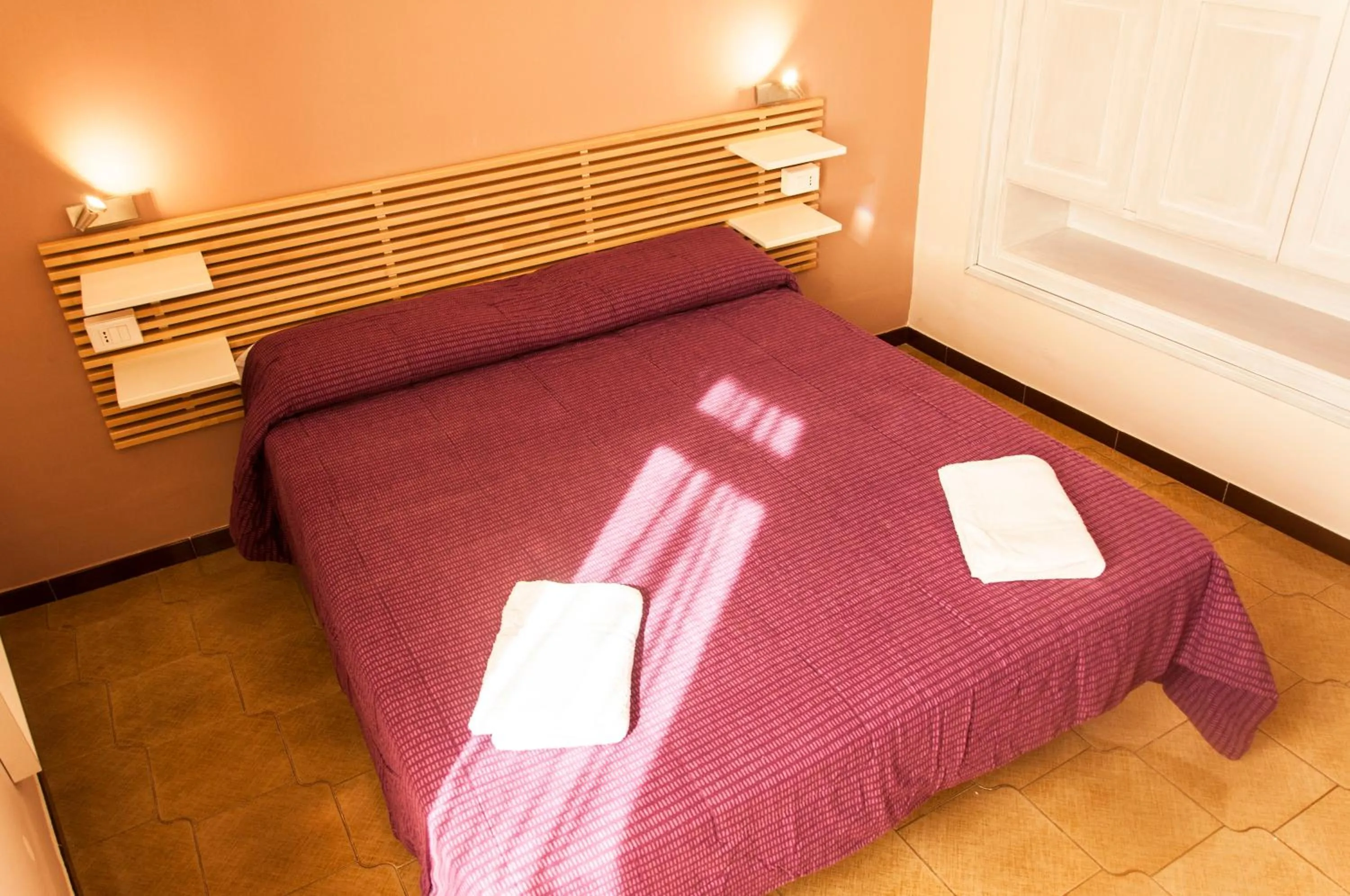 Bed in Palazzo Paladini Rooms Lecce