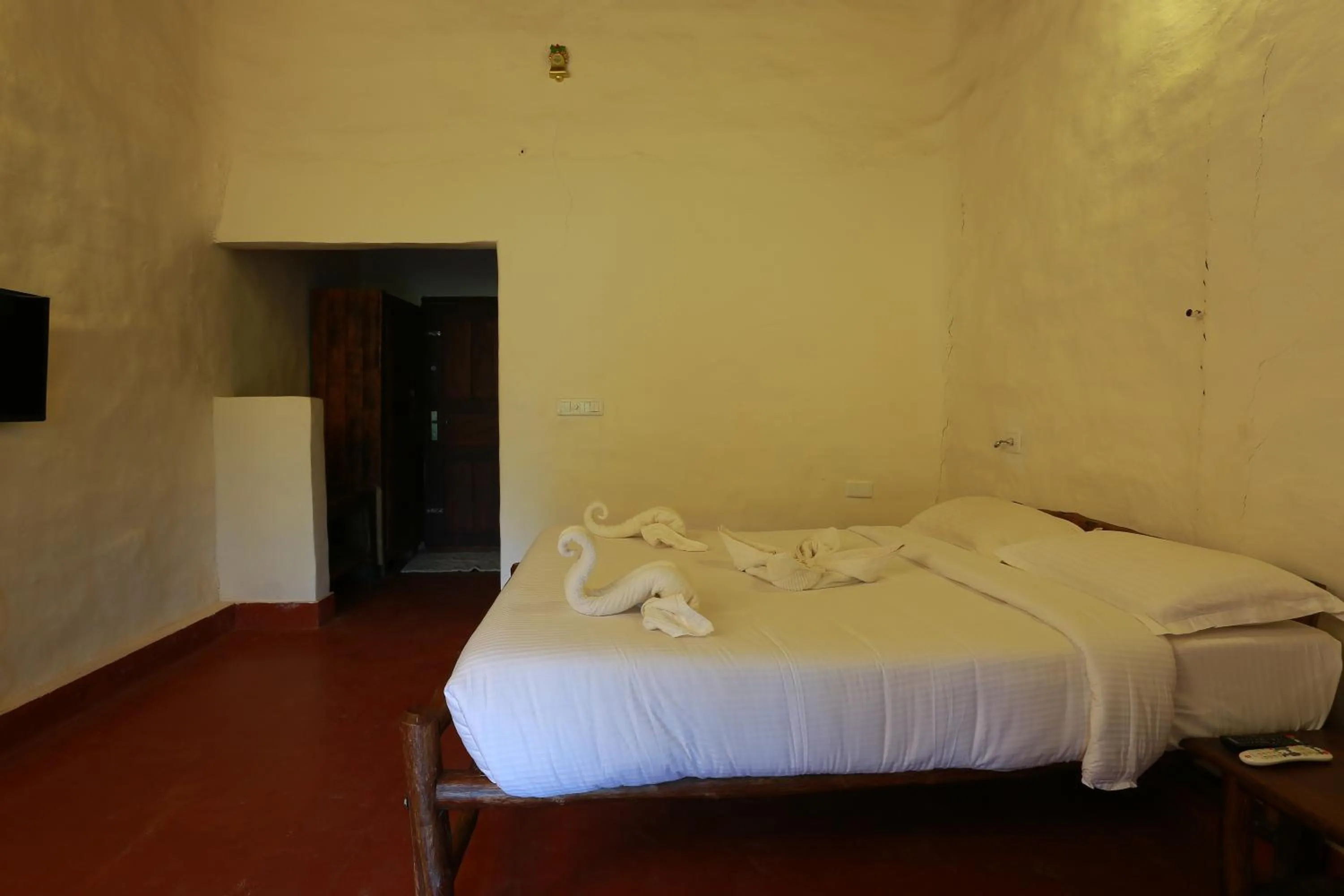 Bed in Deshadan Eco Valley Resort - An Eco friendly Mud House