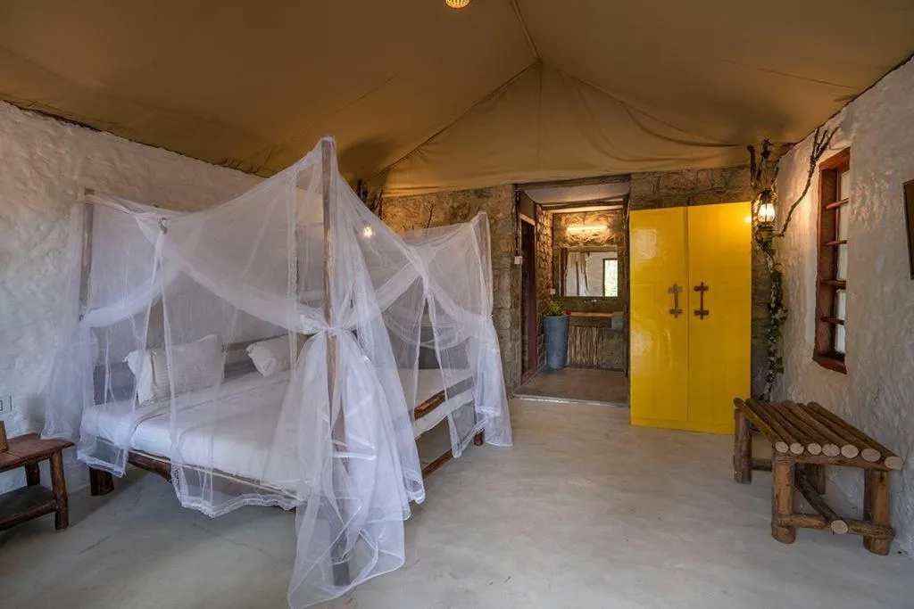 Bed in Deshadan Eco Valley Resort - An Eco friendly Mud House