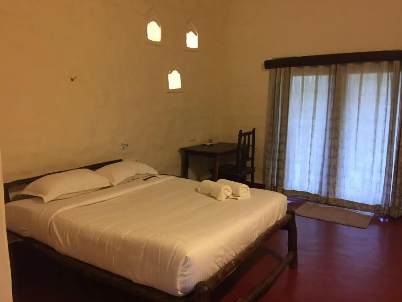 Bed in Deshadan Eco Valley Resort - An Eco friendly Mud House