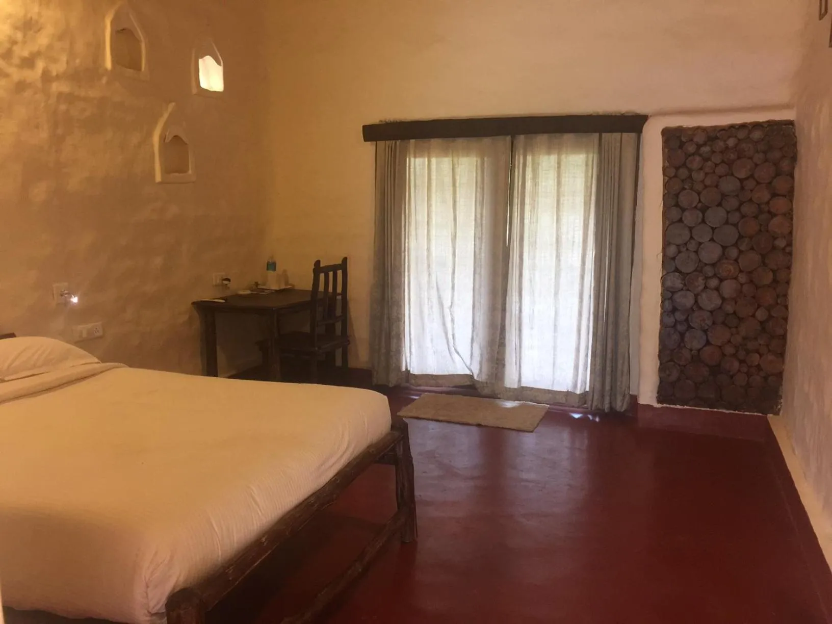 Photo of the whole room, Bed in Deshadan Eco Valley Resort - An Eco friendly Mud House