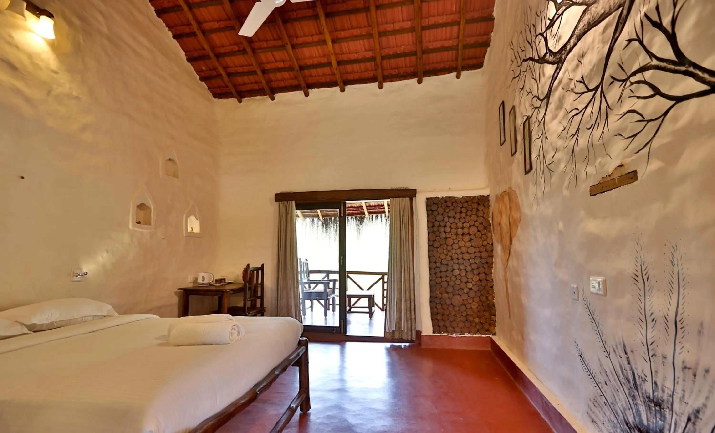 Bed in Deshadan Eco Valley Resort - An Eco friendly Mud House