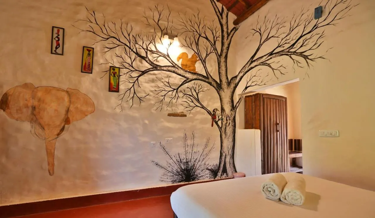 Bed in Deshadan Eco Valley Resort - An Eco friendly Mud House