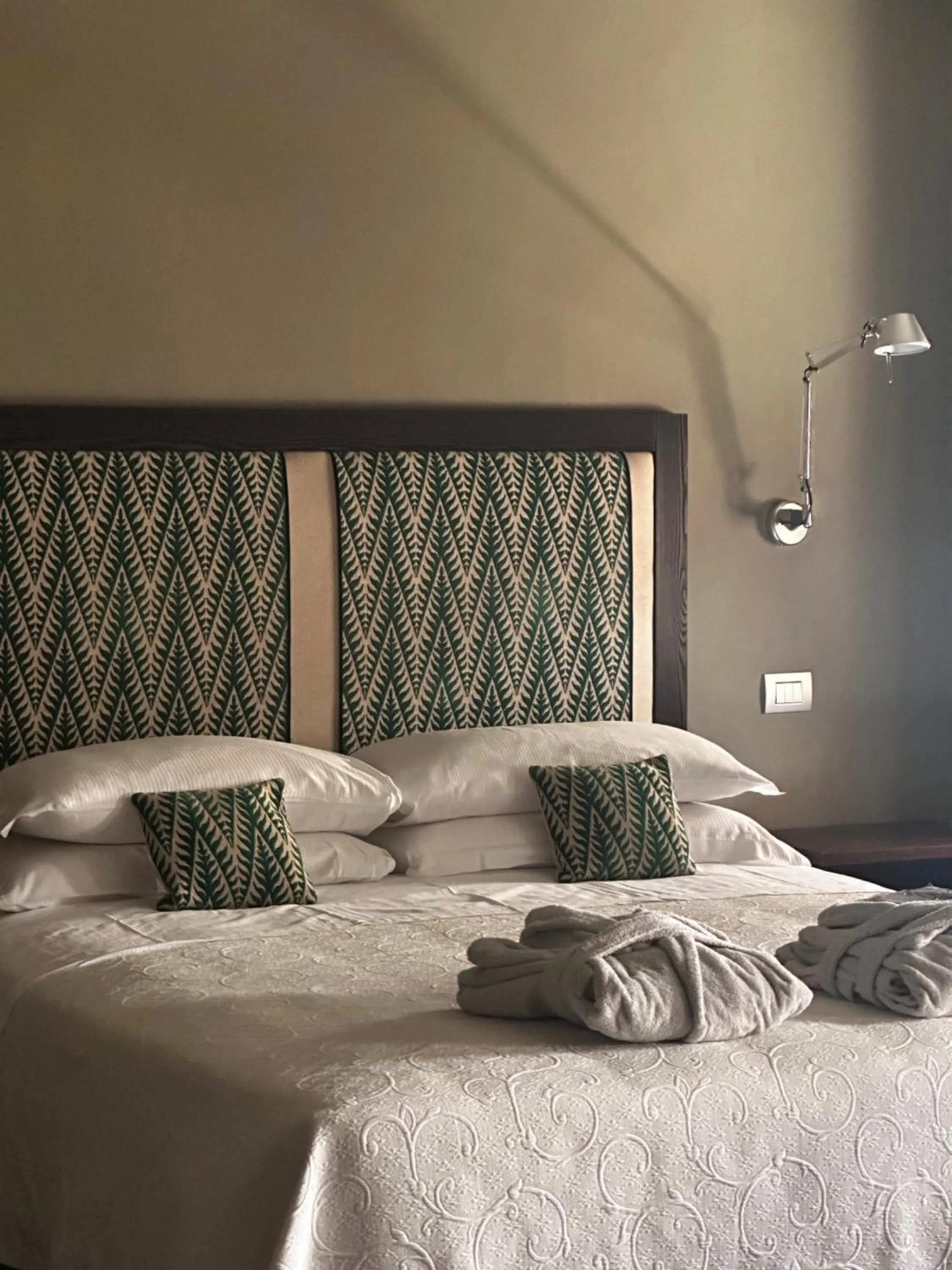 Bed in Hotel Palazzo Piccolomini