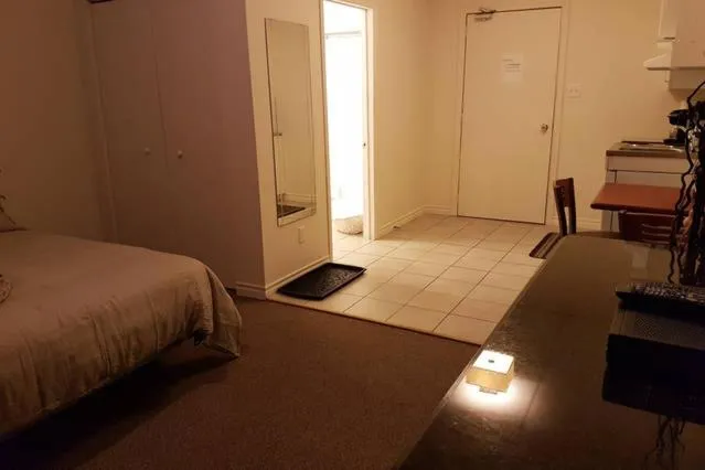 Bed in Cozy Little Studio #16 by Amazing Property Rentals