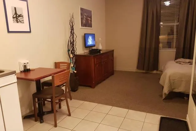 Dining area, Bed in Cozy Little Studio #16 by Amazing Property Rentals