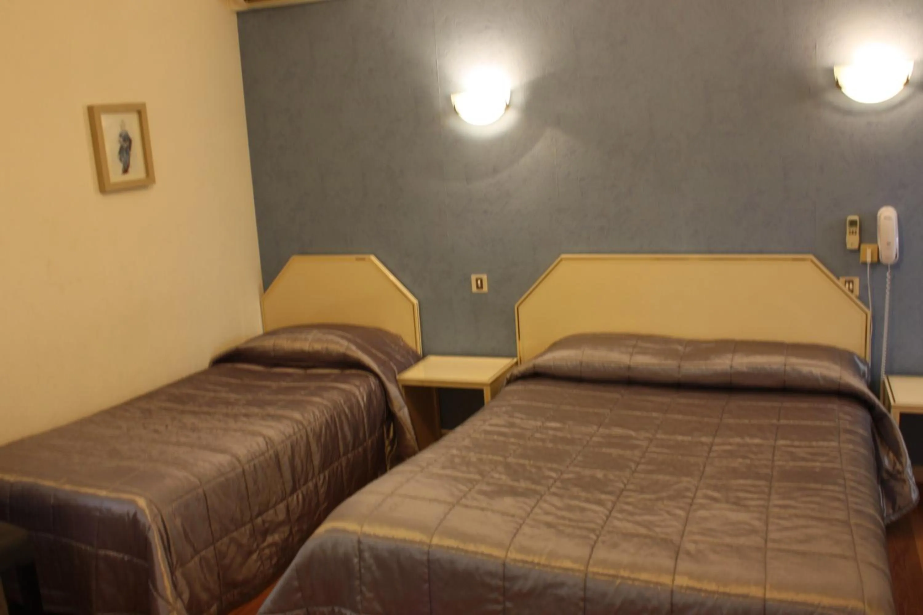 Bed in Hôtel restaurant LOGIS HOTELLERIE DE BALAJAN