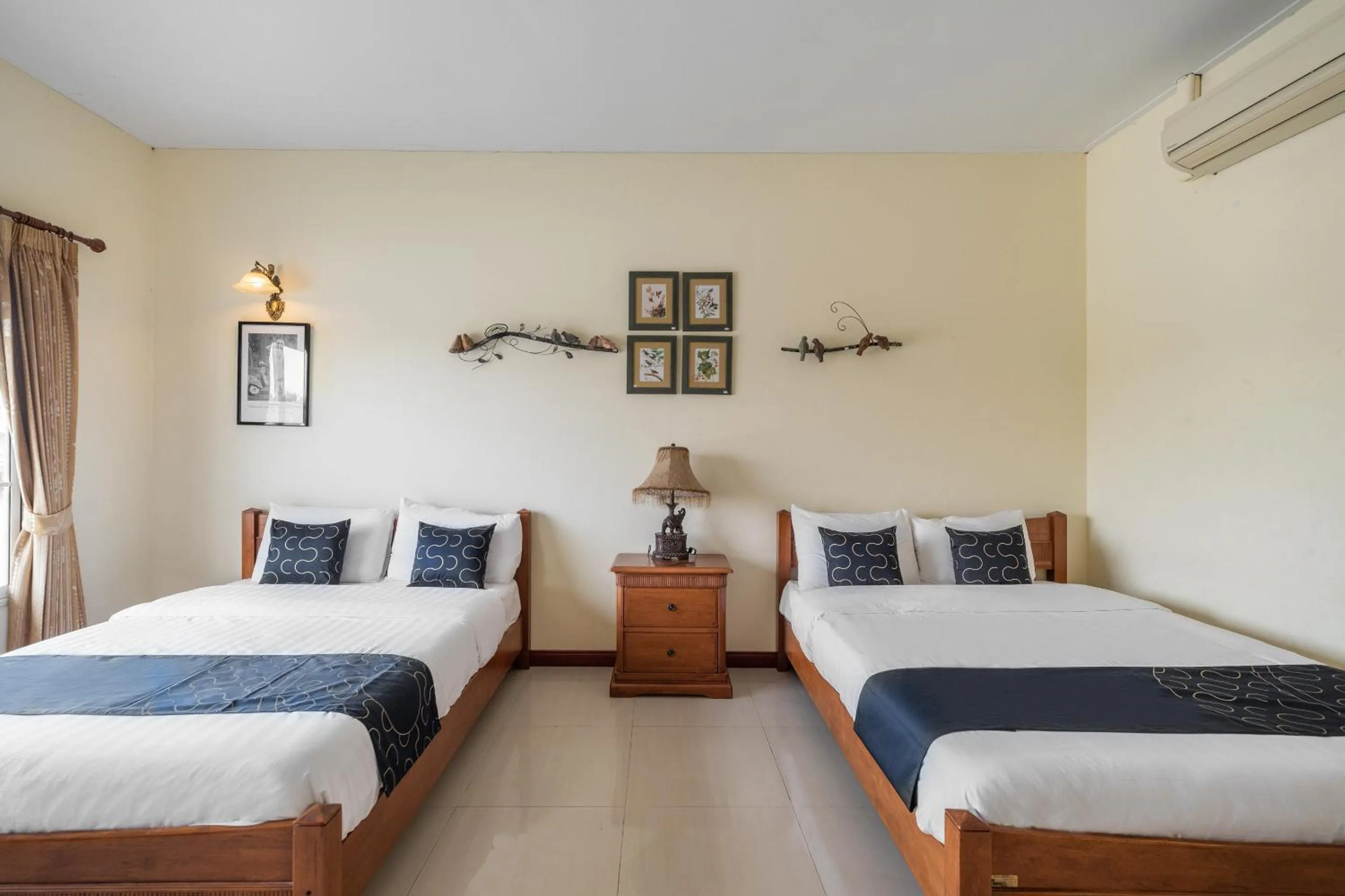 Bedroom in Capital O 805 Suan Palm Farm Nok Resort