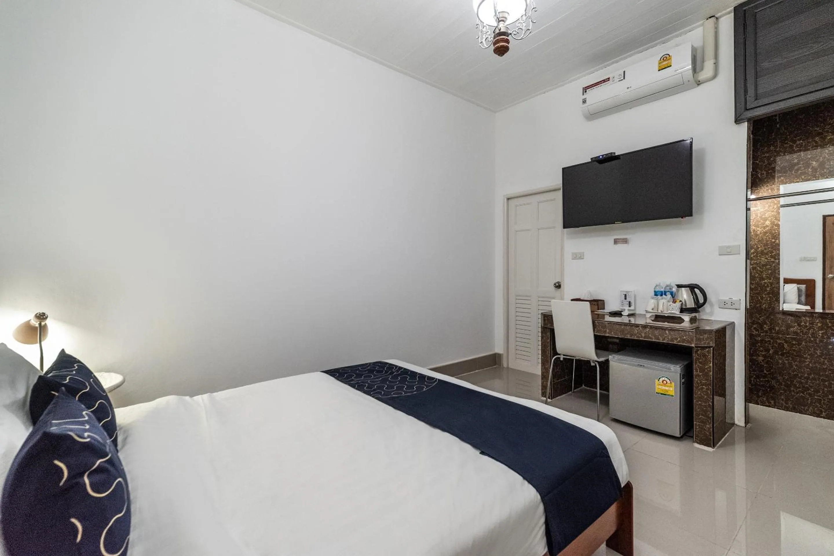 Bedroom, TV/Entertainment Center in Capital O 805 Suan Palm Farm Nok Resort