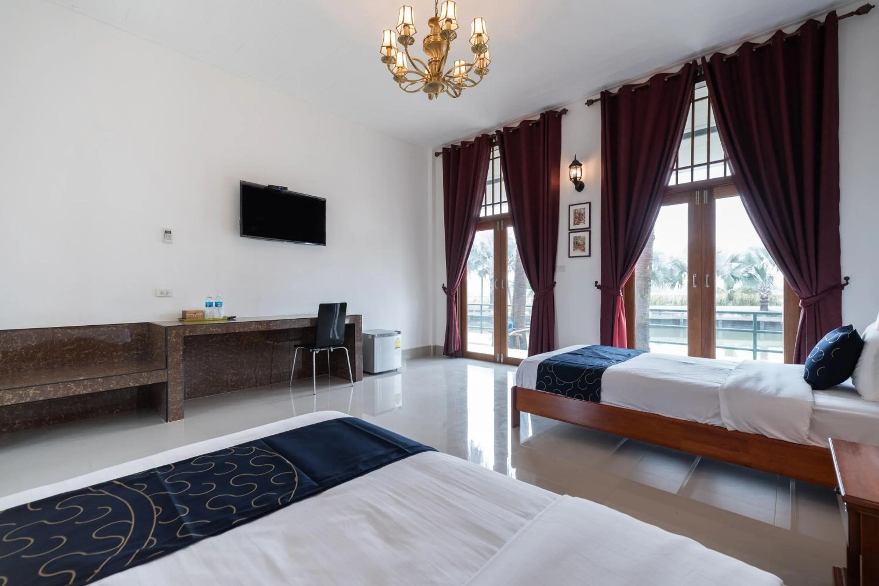 Bedroom in Capital O 805 Suan Palm Farm Nok Resort