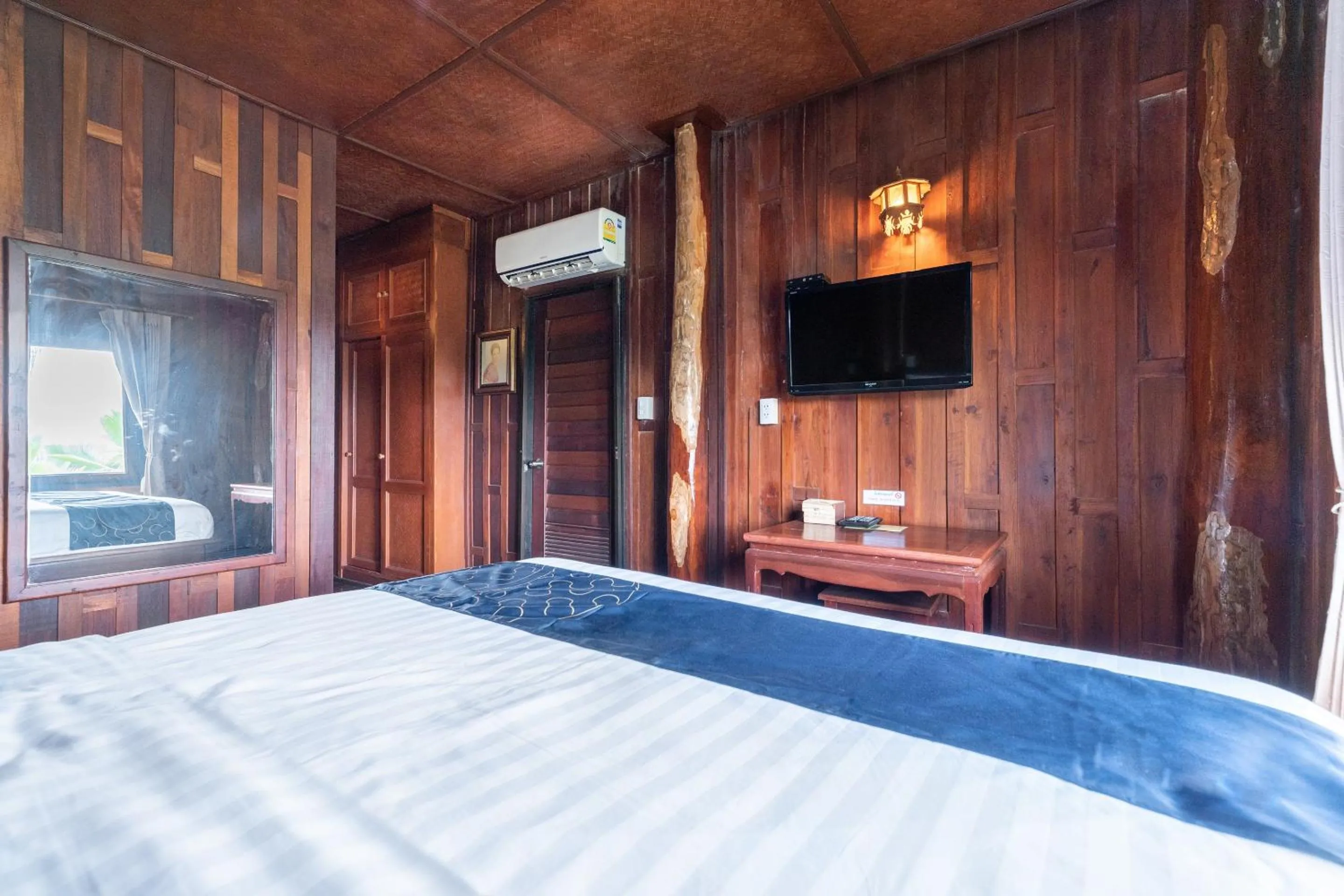 Bedroom, TV/Entertainment Center in Capital O 805 Suan Palm Farm Nok Resort