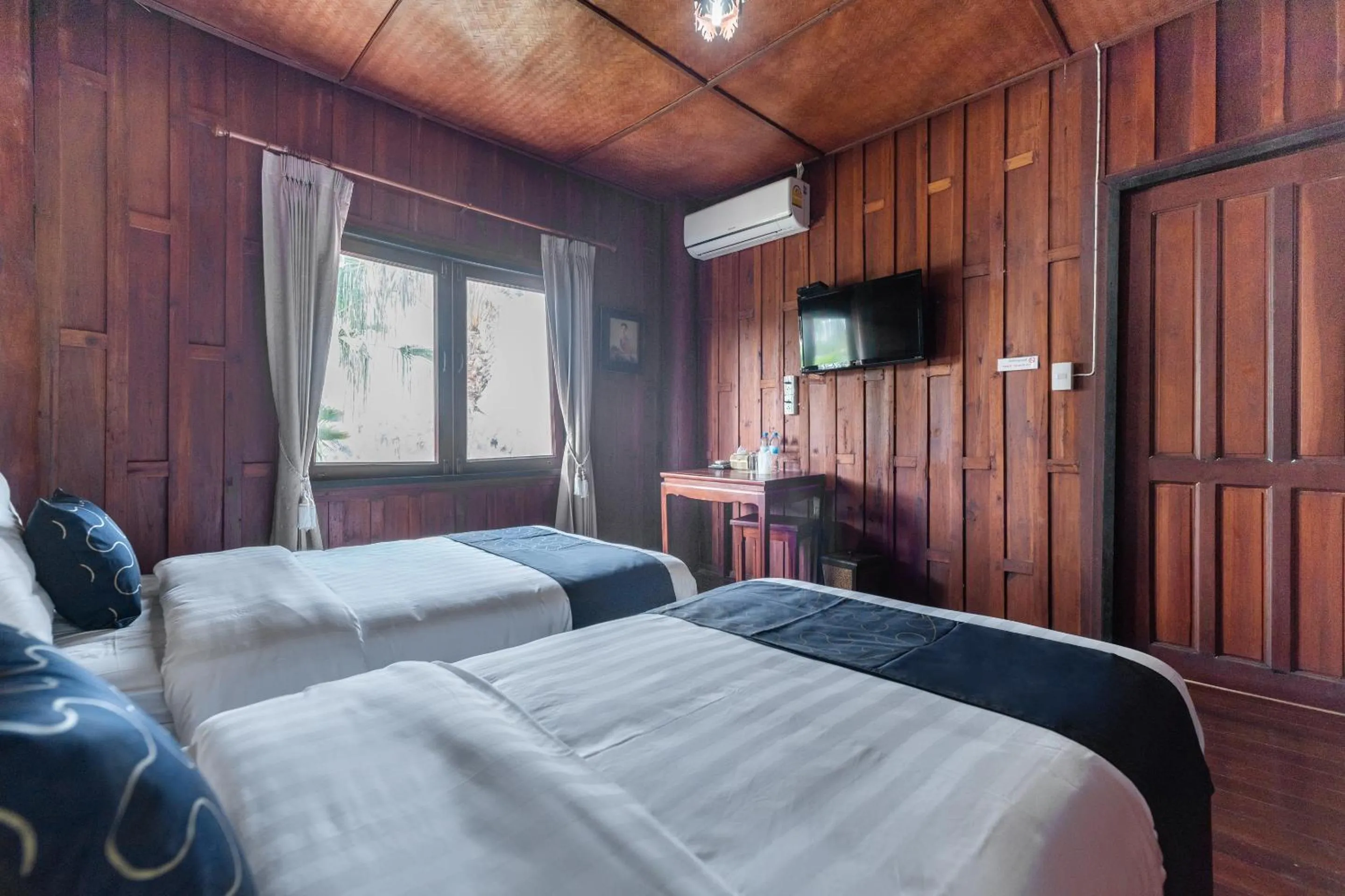 Bedroom in Capital O 805 Suan Palm Farm Nok Resort