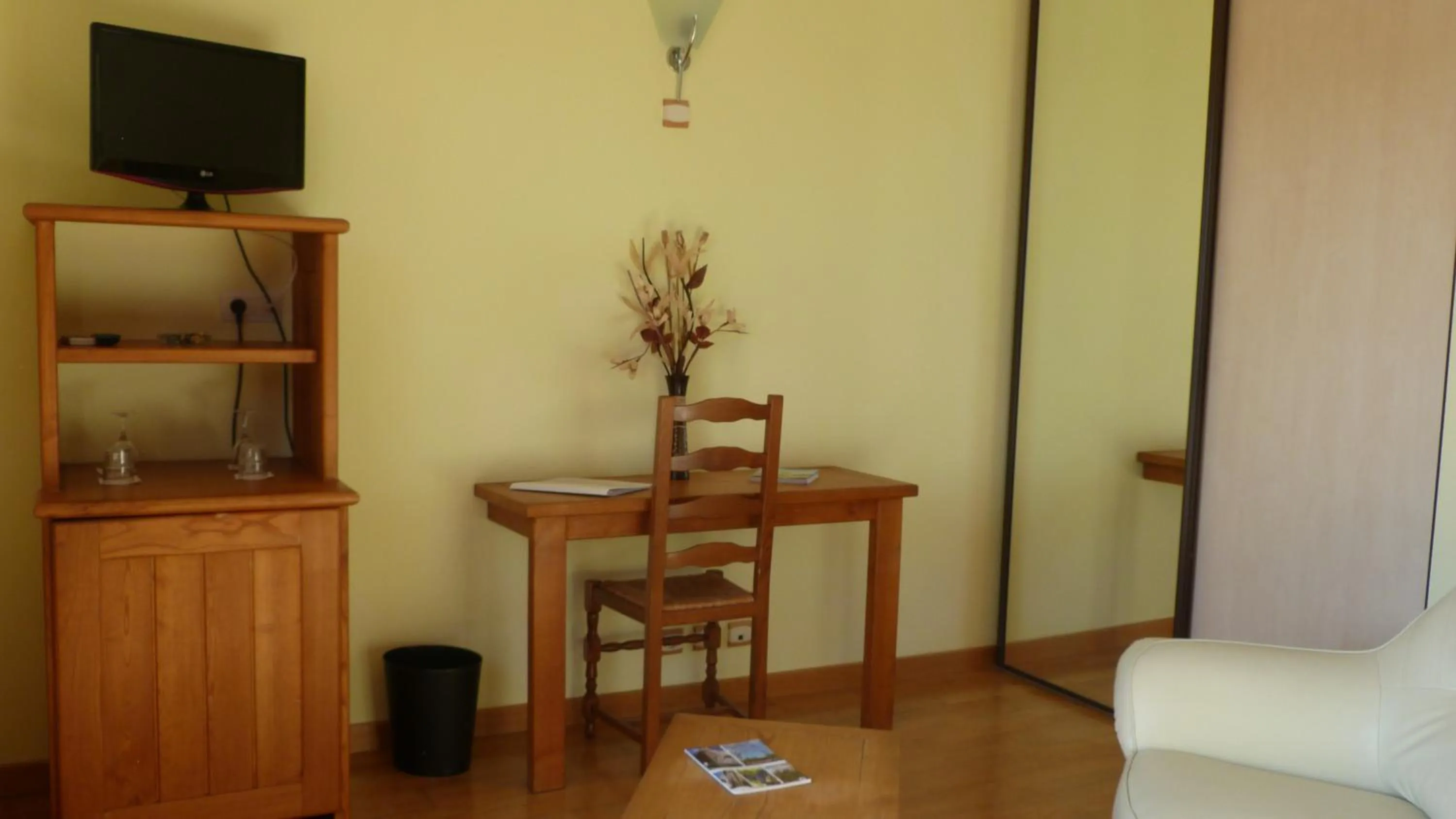 Seating area in Logis Hôtel-restaurant La Mère Biquette