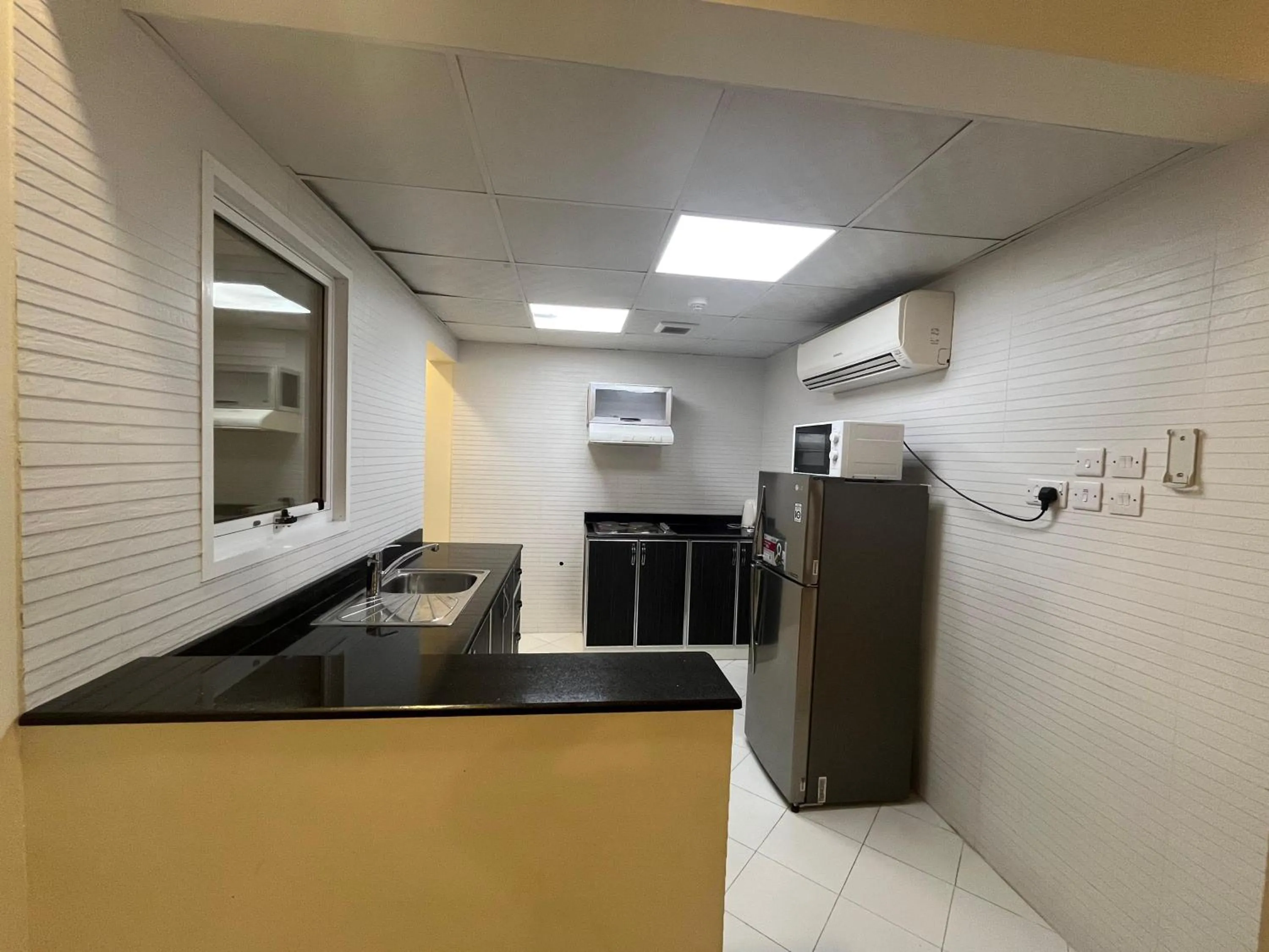 Kitchen or kitchenette in Muscat Hills Hotel