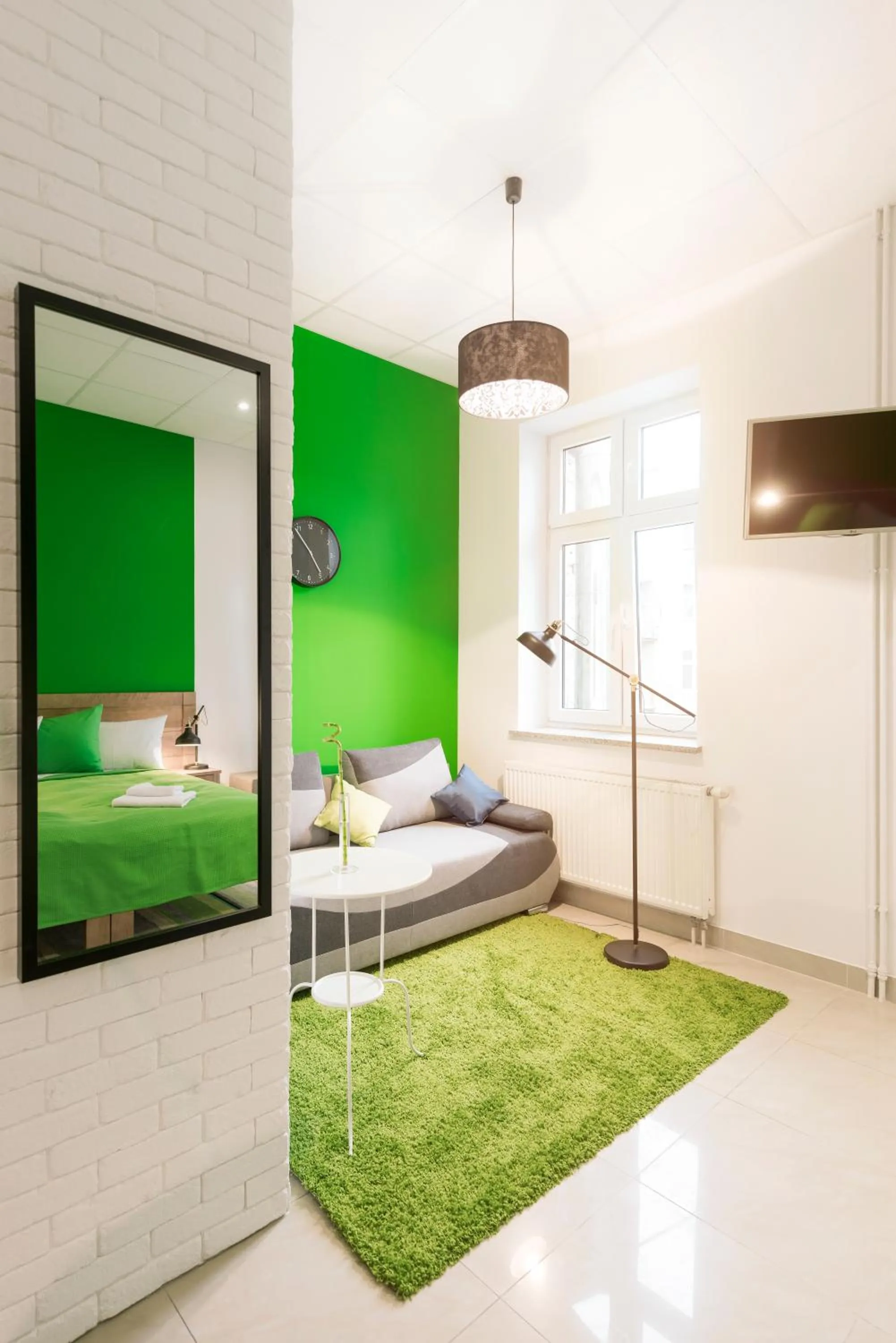 Seating area, Bed in Ginger ApartHostel