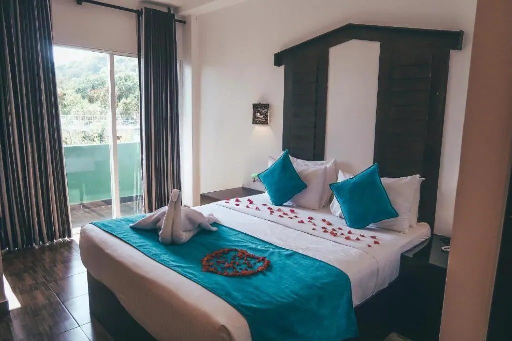 Bed in Sunshine Resort & Spa Sigiriya